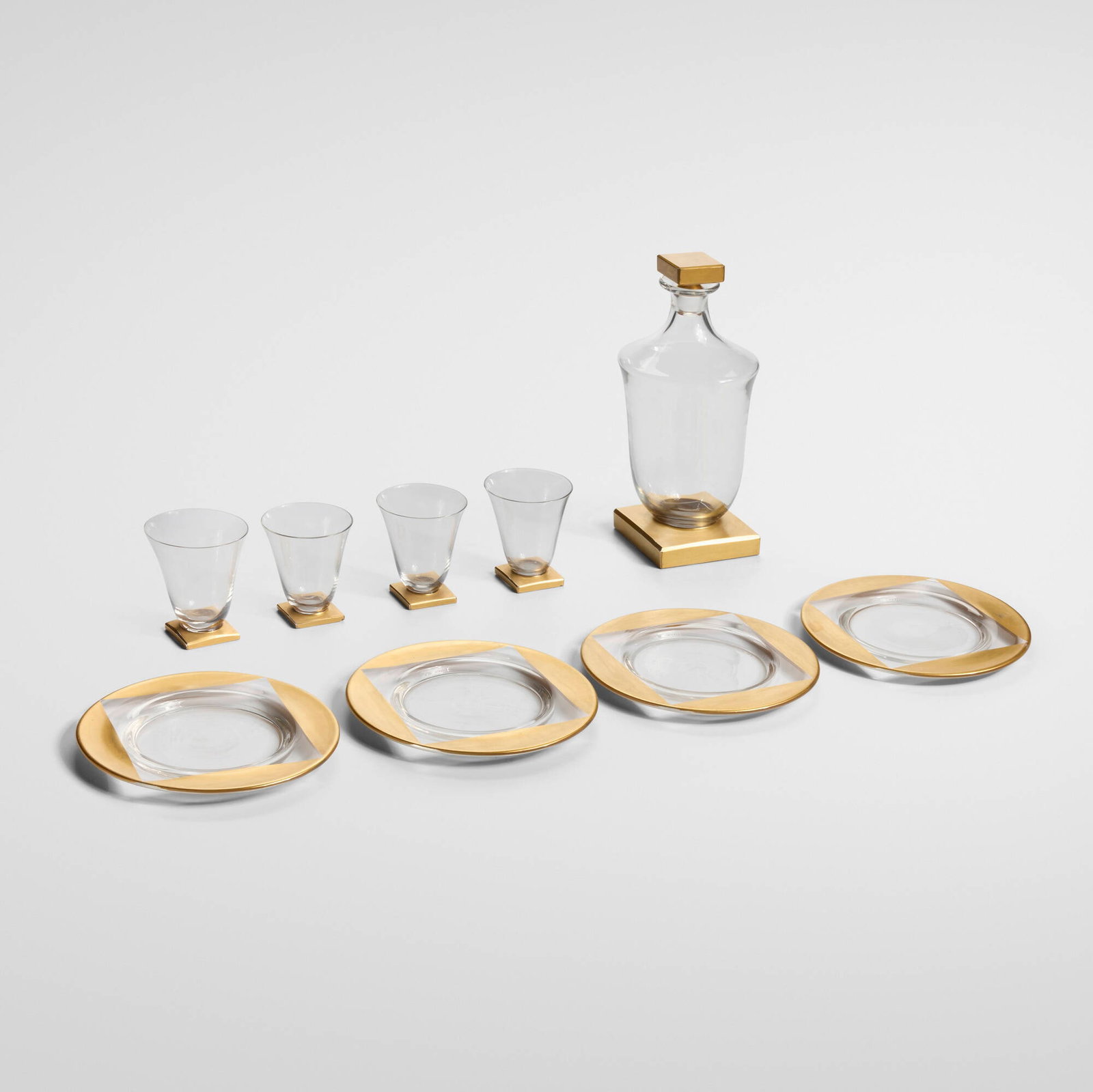 Delvaux Paris, Art Deco cocktail service: Delvaux Paris Art Deco cocktail service France, c. 1925 clear glass with gilding tallest: 9.5 h x 4.375 dia in (24 x 11 cm) shortest: 0.5 h x 6.75 dia in (1 x 17 cm) Service is comprised of a