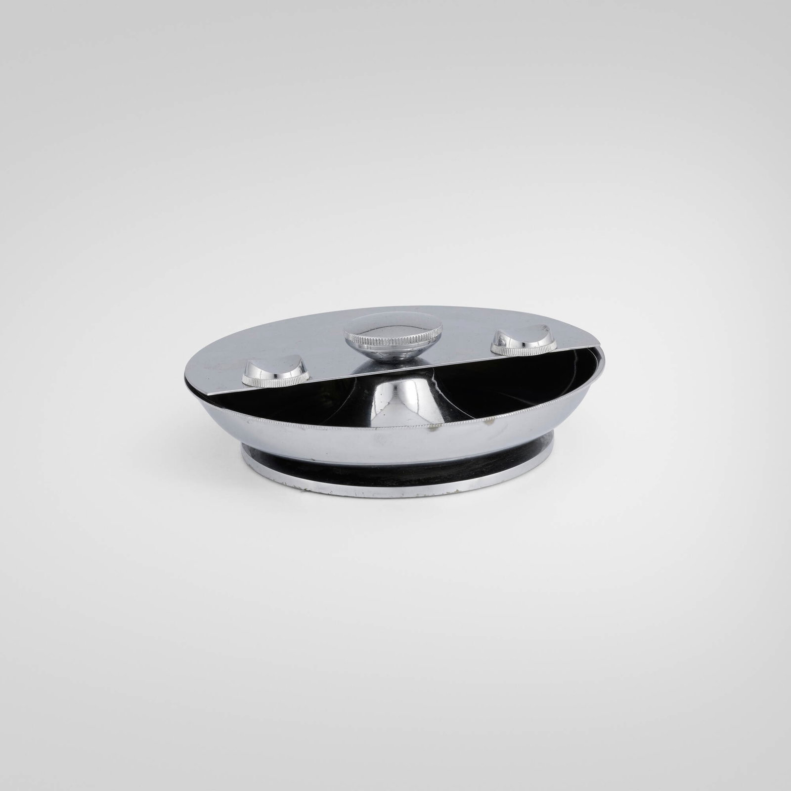Machine Age, Ashtray: Machine Age Ashtray USA, c. 1950 chrome-plated steel, felt 2 h x 6.25 dia in (5 x 16 cm) This work will ship from Lambertville, New Jersey.