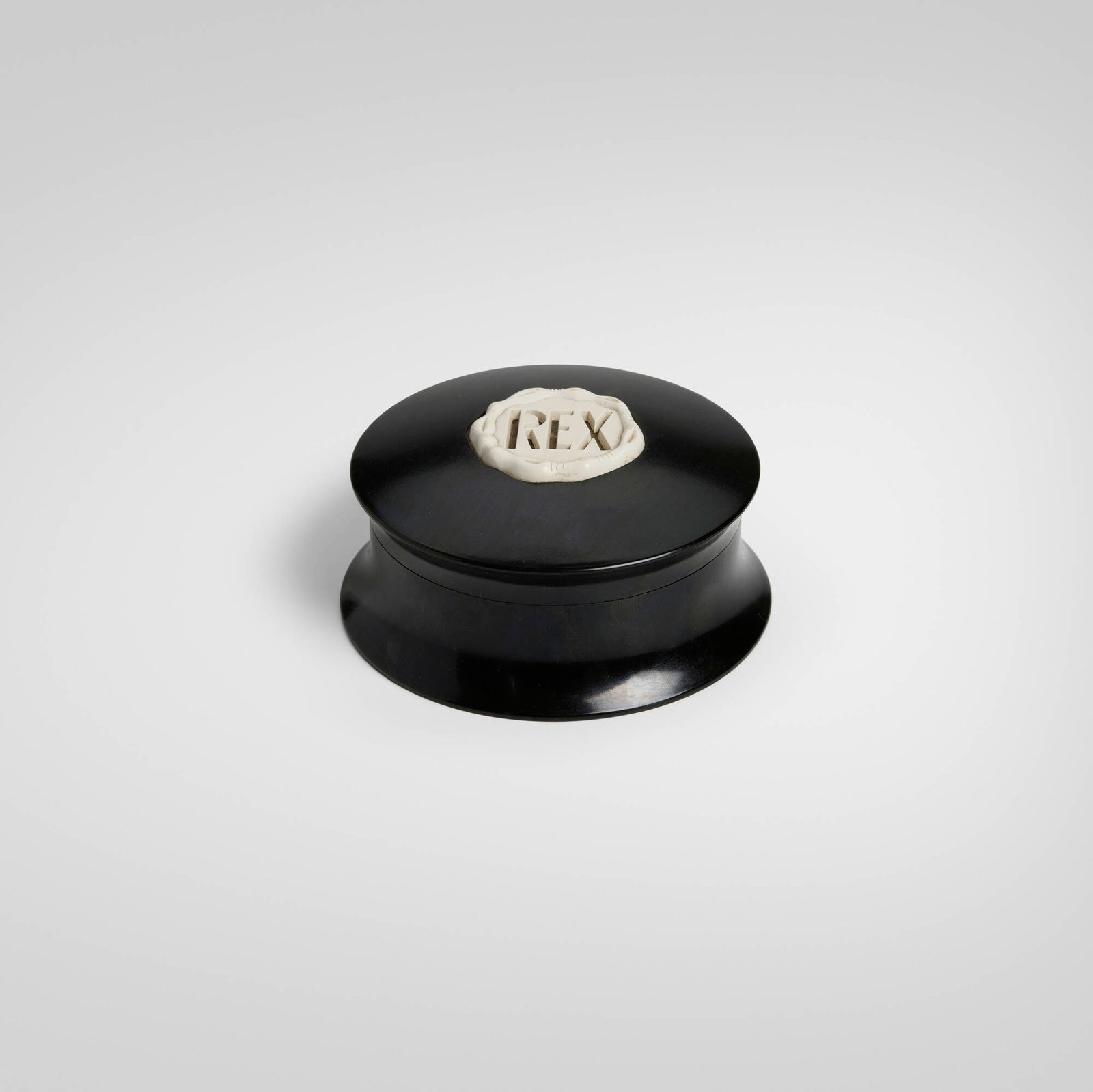 Rex Fifth Avenue, Covered shaving soap bowl: Rex Fifth Avenue Covered shaving soap bowl USA, c. 1935 Bakelite 2 h x 4.25 dia in (5 x 11 cm) Molded manufacturer's mark to lid 'REX'. Molded distributor's mark to underside
