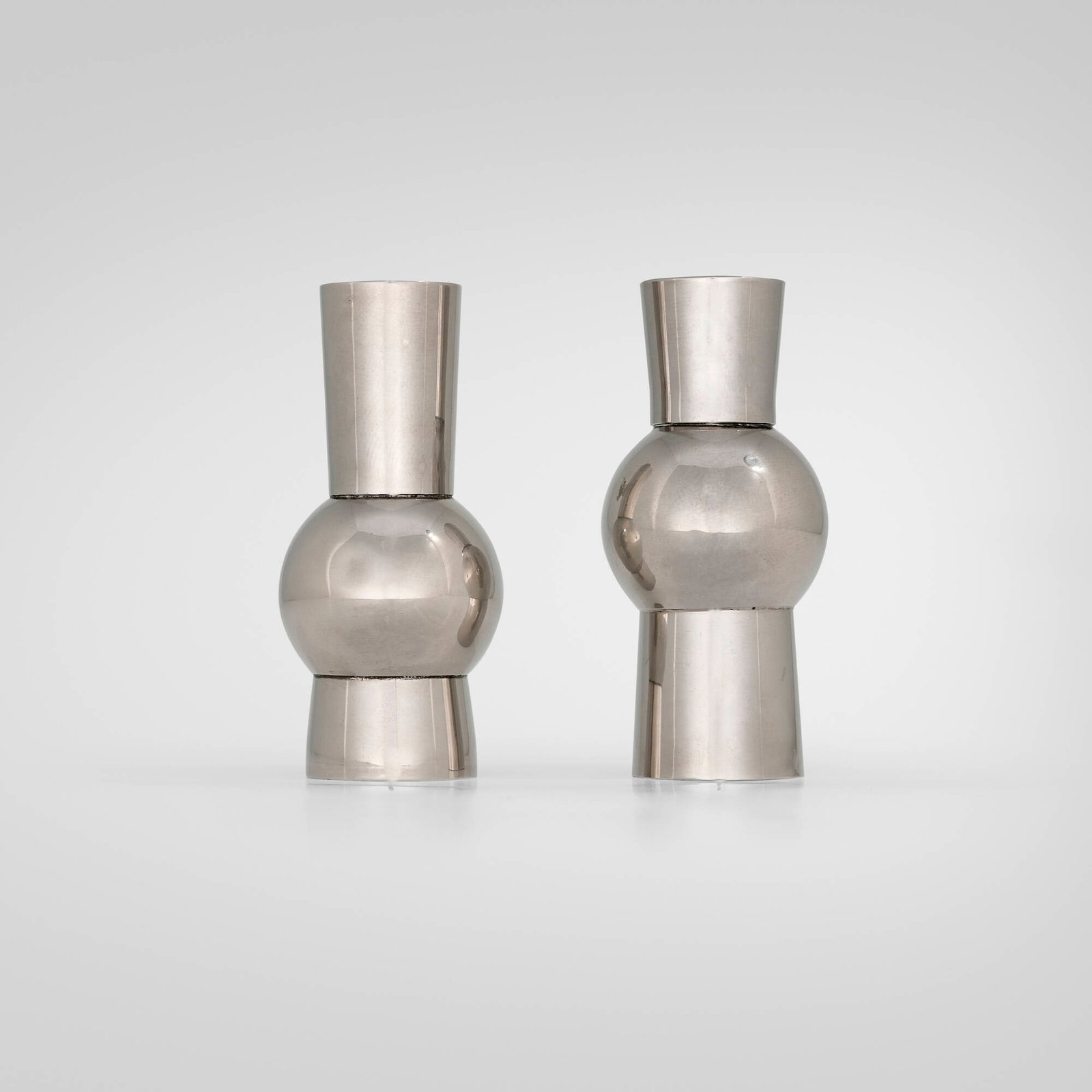 Machine Age, Vases, set of two: Machine Age Vases, set of two USA, c. 1935 pewter 5 h x 2.25 dia in (13 x 6 cm) Literature: Private Collection This work will ship from Chicago, Illinois.