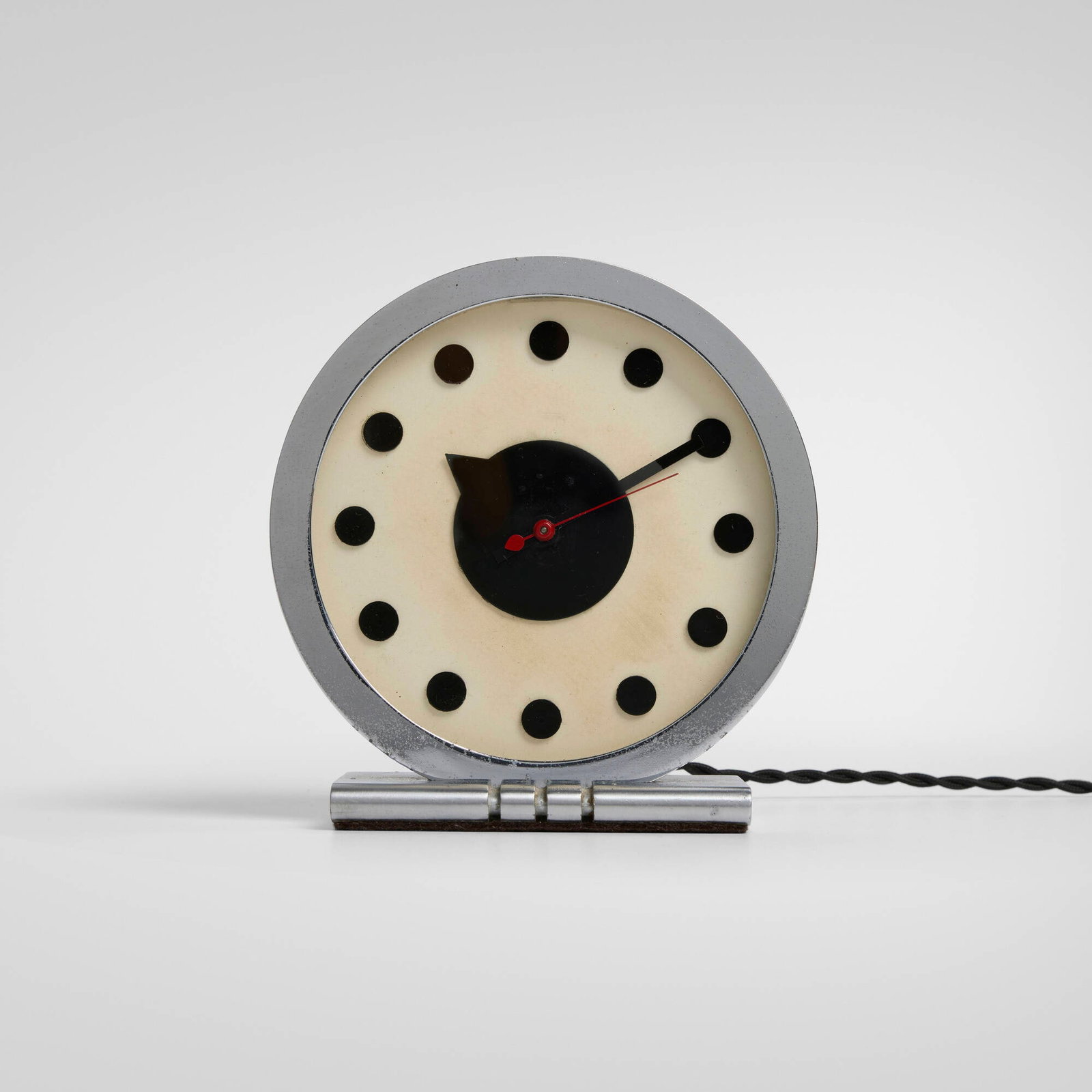 Gilbert Rohde, Table clock, model 4706: Gilbert Rohde Table clock, model 4706 Herman Miller Clock Company USA, c. 1933 chrome-plated brass, glass, aluminum 6.25 h x 6 w x 3 d in (16 x 15 x 8 cm) Cast manufacturer's mark to reverse