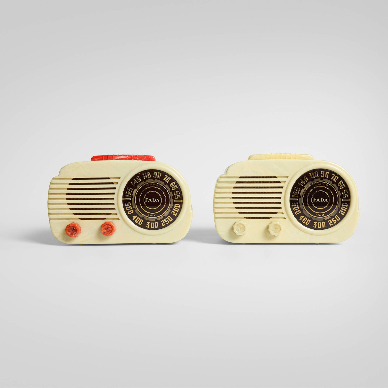 Fada, The Cloud radios model 845, set of two: Fada The Cloud radios model 845, set of two USA, 1946 molded polystyrene, reverse-screenprinted glass, fabric 6.75 h x 10.5 w x 6 d in (17 x 27 x 15 cm) Partial paper manufacturer's label to