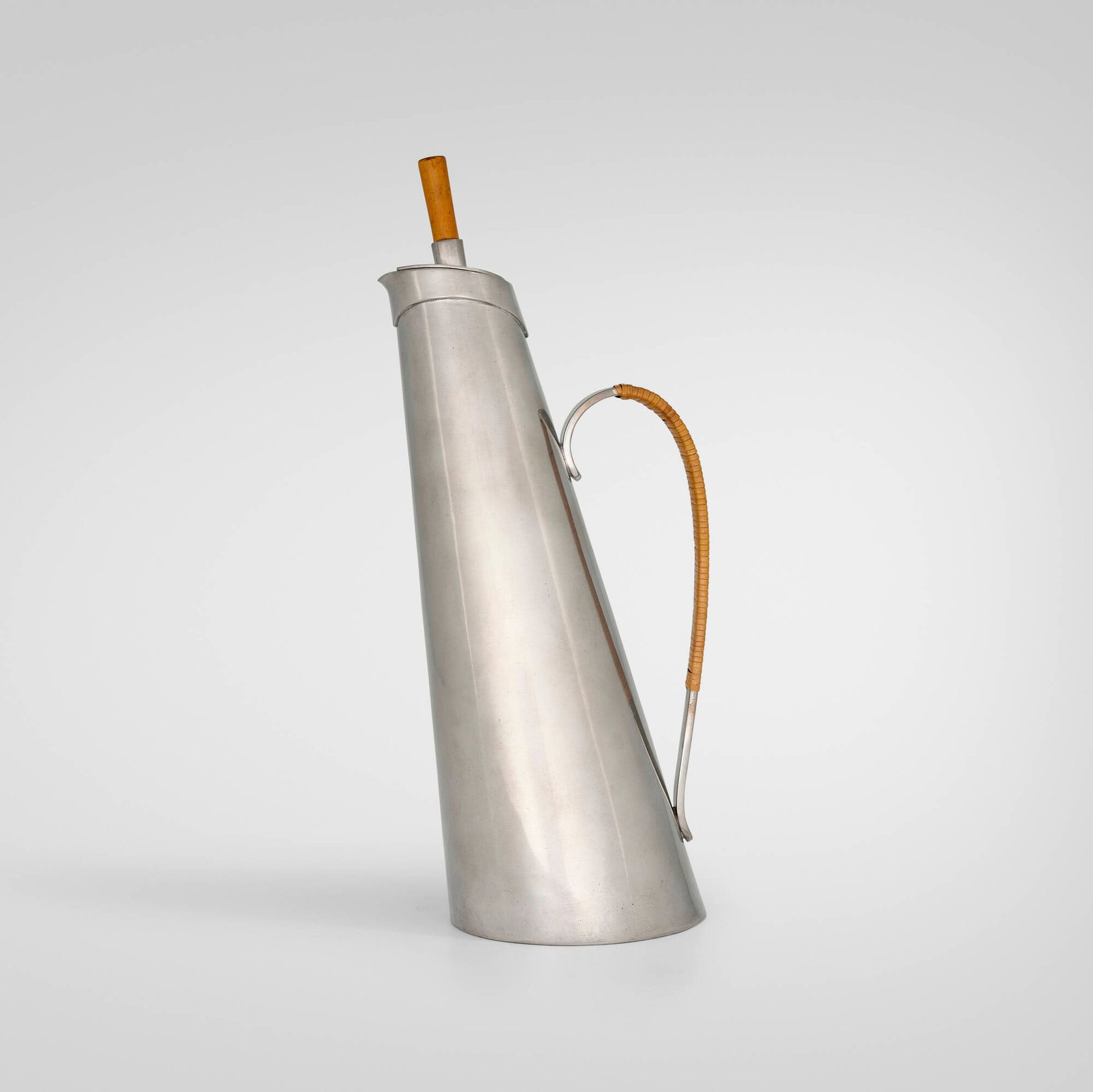 Porter Blanchard, Tall lidded pitcher: Porter Blanchard Tall lidded pitcher Pacoima, USA, c. 1945 pewter, cane, beech 13.75 h x 5.75 w x 4.5 d in (35 x 15 x 11 cm) Impressed signature to underside 'Handmade Colonial Pewter Porter Blan