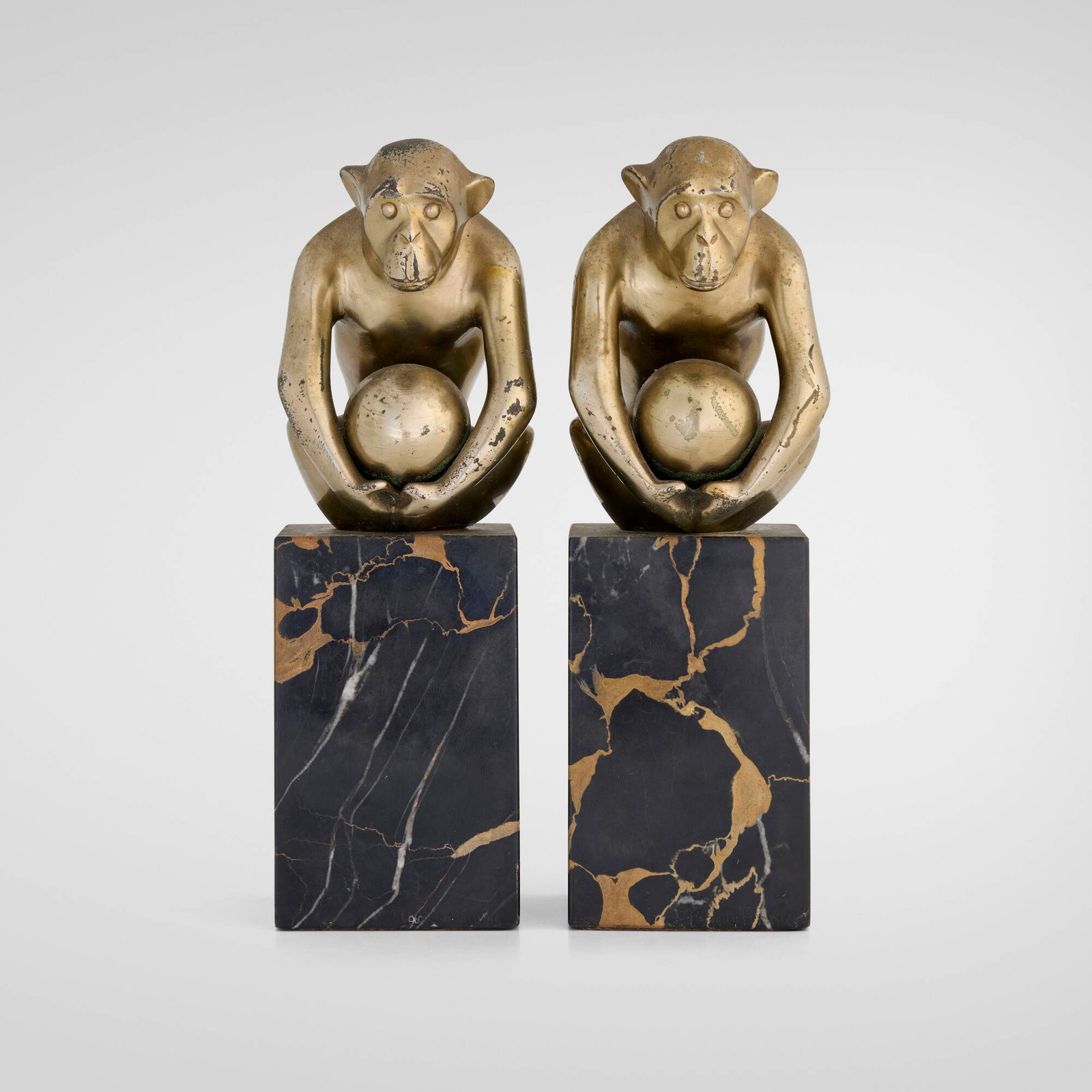 Georges Henri Laurent, Seated Monkey bookends, pair: Georges Henri Laurent Seated Monkey bookends, pair France, c. 1930 patinated bronze, marble 8.125 h x 2.625 w x 3.25 d in (21 x 7 x 8 cm) Incised signature to side of each example 'GH Laurent