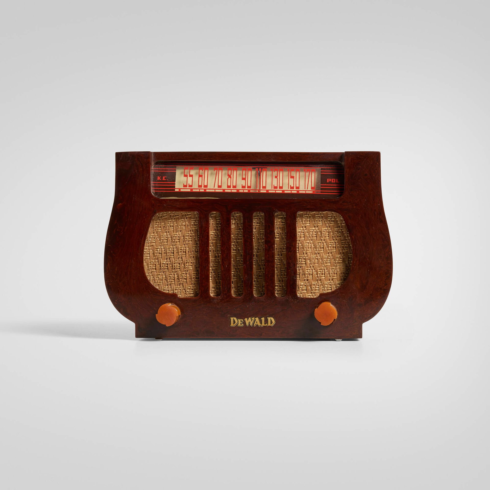 DeWald Radio Manufacturing Corporation, Harp radio, model A-501: DeWald Radio Manufacturing Corporation Harp radio, model A-501 USA, c. 1941 Catalin, plastic, fabric 6.375 h x 9.75 w x 6.375 d in (16 x 25 x 16 cm) Stamped manufacturer's mark to reverse