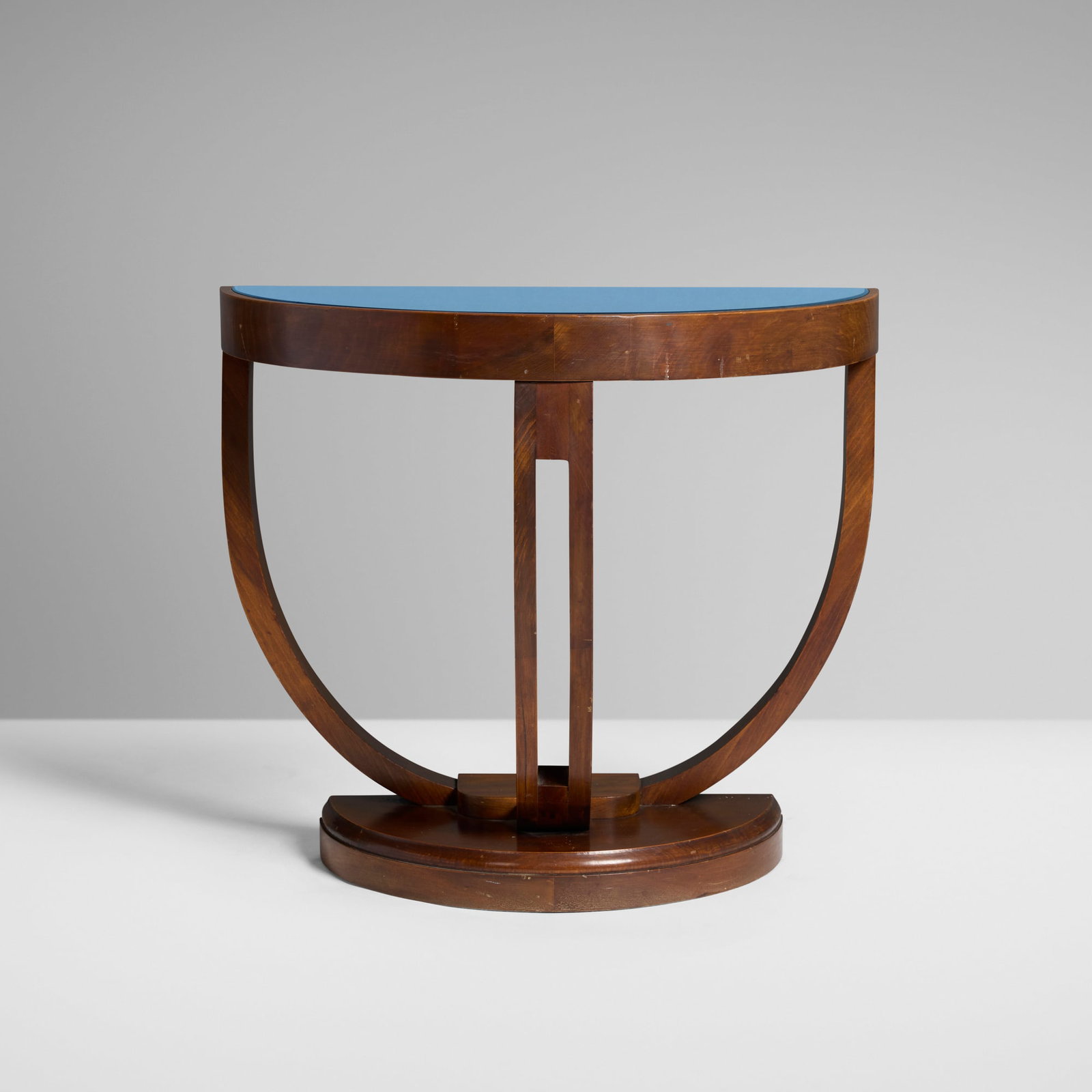 Art Deco, Demilune console table: Art Deco Demilune console table c. 1930 mahogany, blue glass 22 h x 24.75 w x 12.75 d in (56 x 63 x 32 cm) Provenance: Private Collection This work will ship from Chicago, Illinois.</