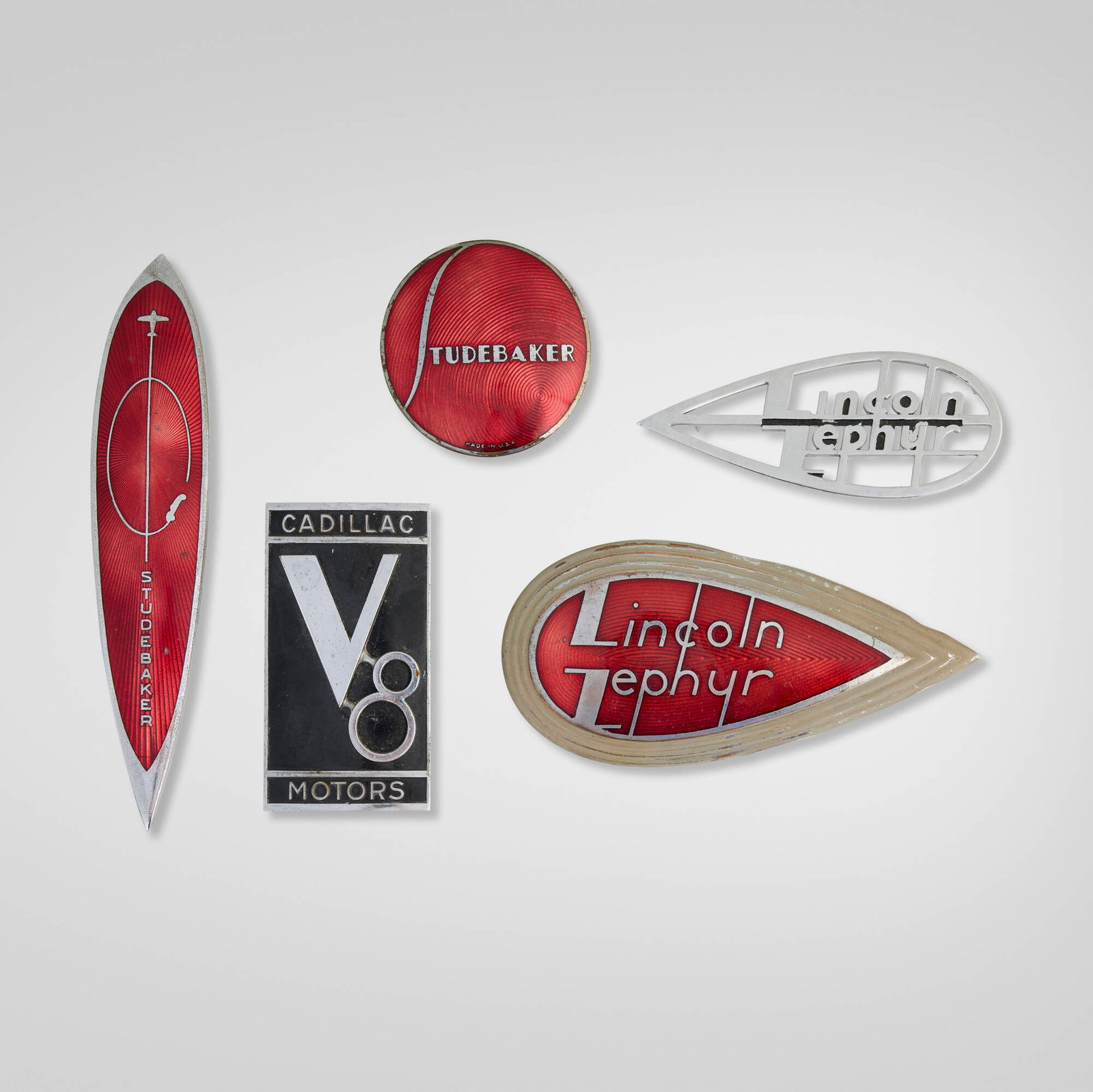 American, Collection of five grille emblems: American Collection of five grille emblems c. 1935-45 chrome-plated and enameled brass largest: 2.875 h x 6 w x 0.75 d in (7 x 15 x 2 cm) smallest: 1.875 h x 4.75 w x 0.5 d in (5 x 12 x 1 cm)