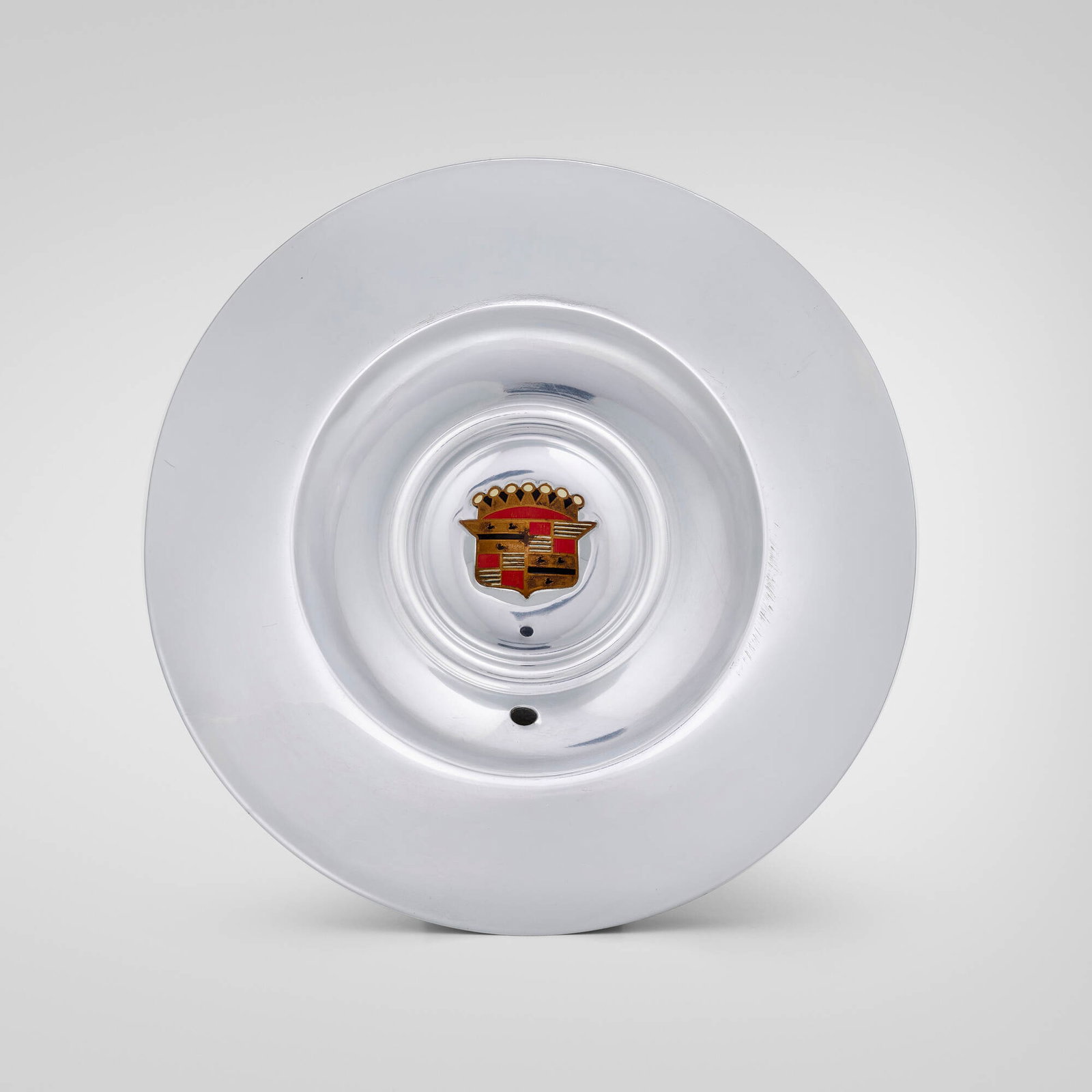 General Motors, Cadillac Eldorado sombrero-style hub cap: General Motors Cadillac Eldorado sombrero-style hub cap USA, 1953 chrome-plated and enameled steel 2.5 h x 15.5 dia in (6 x 39 cm) Cast Cadillac logo to center. Provenance: Private Collection This