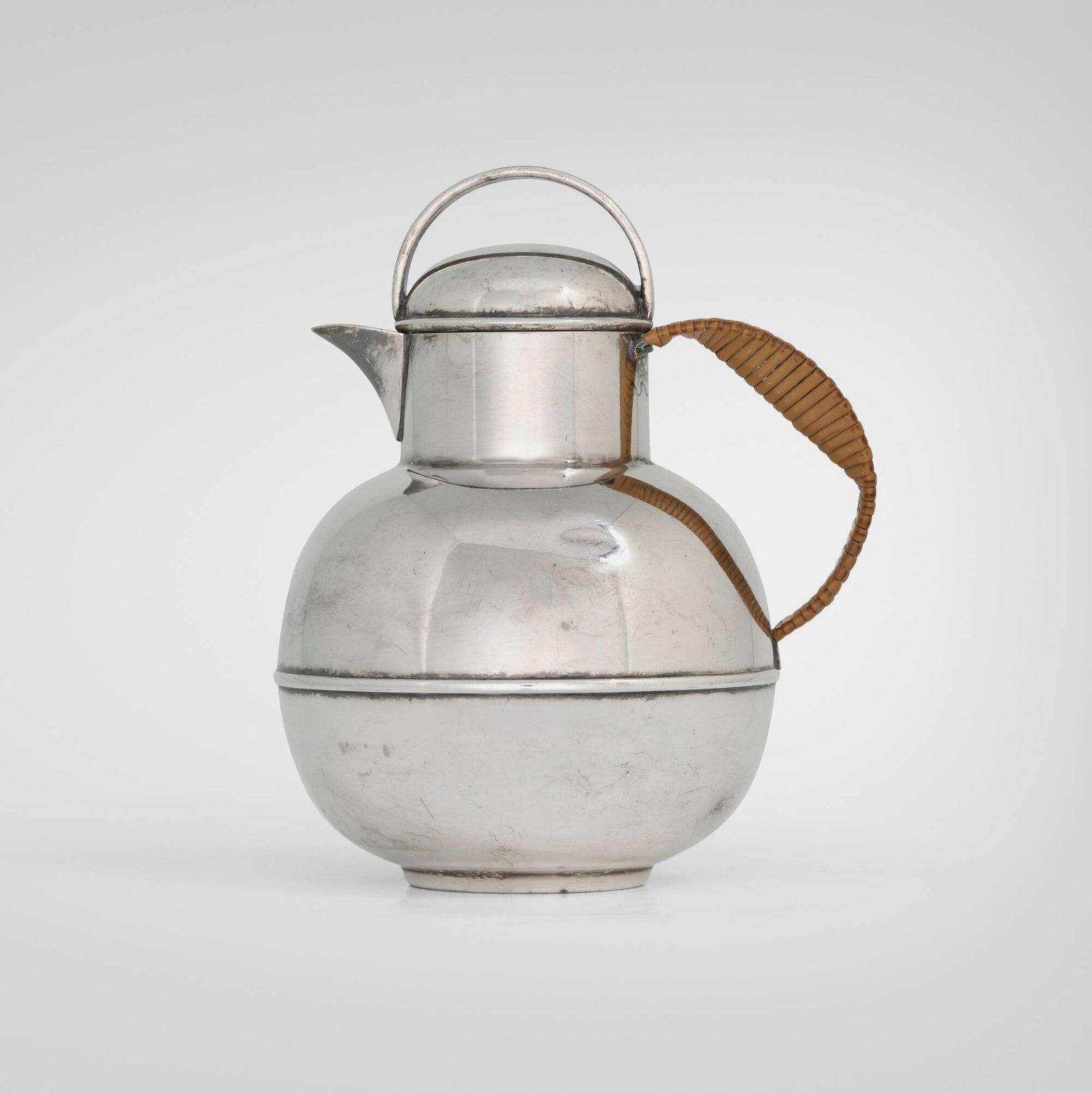 Bernard Rice's Sons, Inc., Hot water pitcher: Bernard Rice's Sons, Inc. Hot water pitcher USA, c. 1935 electroplated nickel silver, cane 5.625 h x 4 w x 4.5 d in (14 x 10 x 11 cm) An example of this design is held in the collection of the