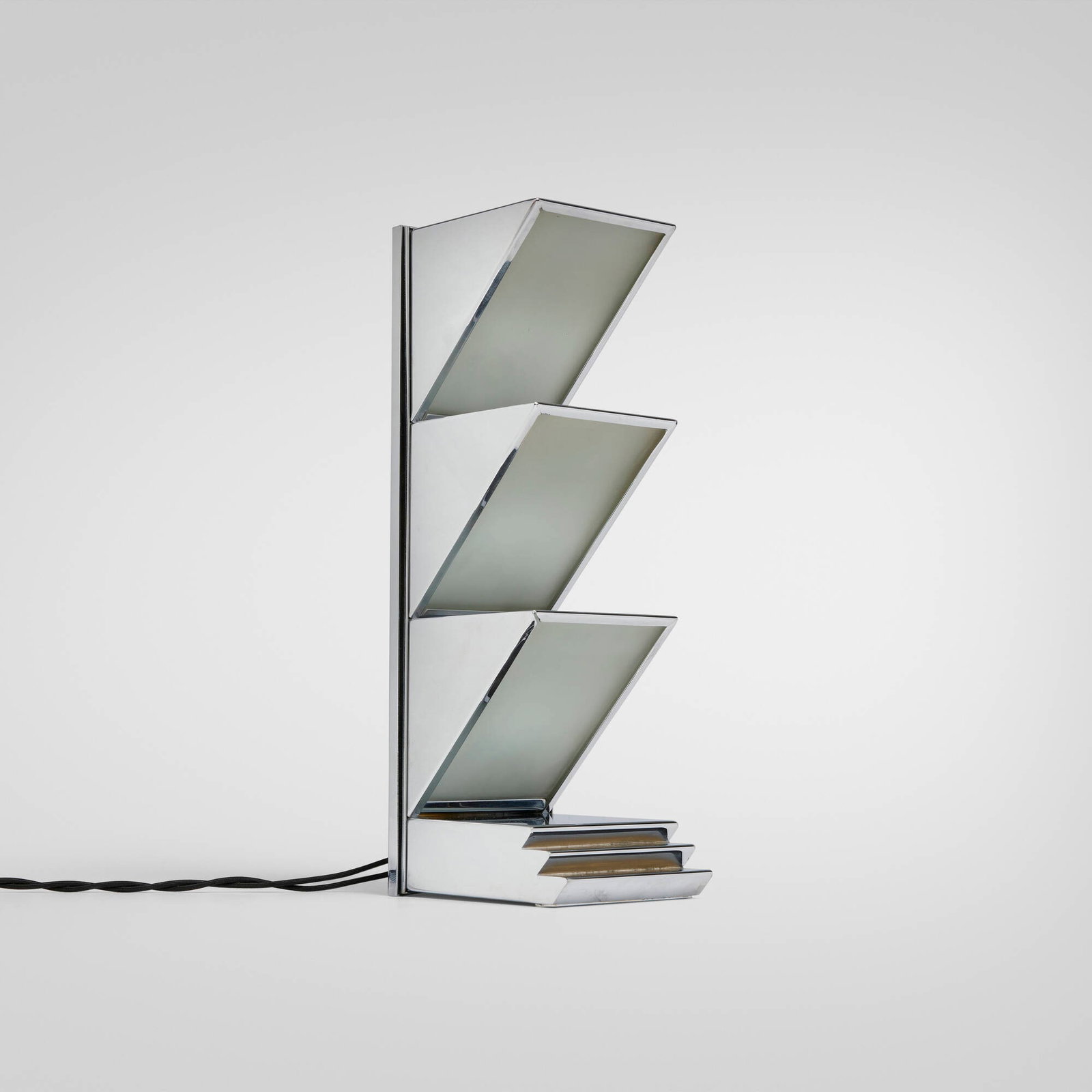 After Donald Deskey, Table lamp: After Donald Deskey Table lamp Tynan c. 2007 chrome-plated brass, frosted glass 14.125 h x 4.25 w x 5.5 d in (36 x 11 x 14 cm) Impressed manufacturer's mark to underside 'Tynan'.