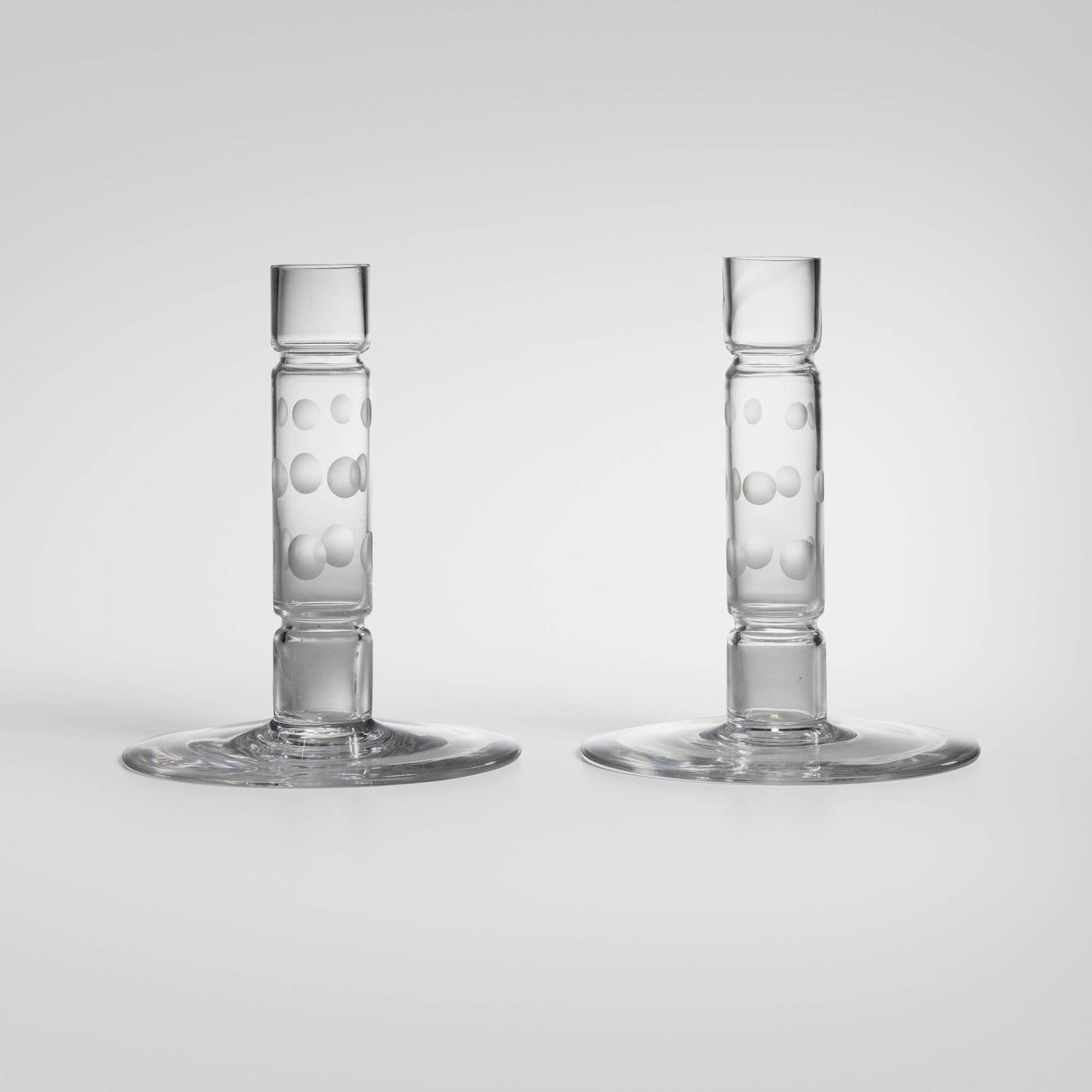 Walter Dorwin Teague, Candlesticks, pair: Walter Dorwin Teague Candlesticks, pair Steuben USA, 1932 glass 6.25 h x 5.125 dia in (16 x 13 cm) Acid-etched manufacturer's mark to underside of each example 'Steuben'. Provenance: