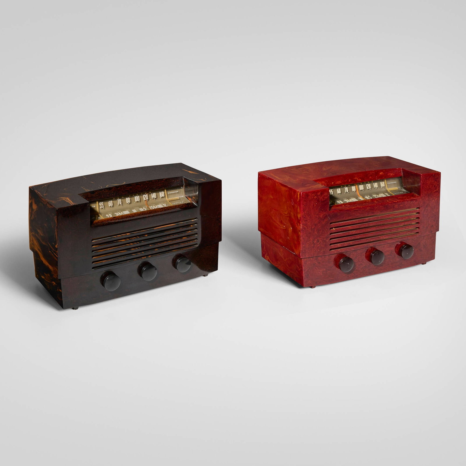 RCA Victor, Radios model 66X8, set of two: RCA Victor Radios model 66X8, set of two USA, 1946 Catalin, glass, fabric 9 h x 15.25 w x 7.5 d in (23 x 39 x 19 cm) Paper manufacturer's label to underside of one example 'RCA Victor Radio