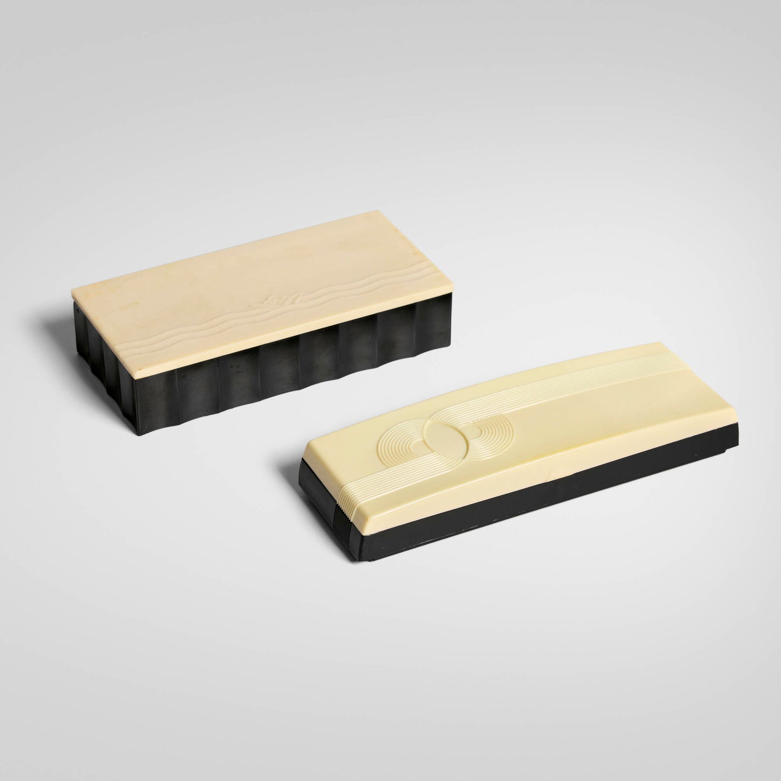 Art Deco, Lidded boxes, set of two: Art Deco Lidded boxes, set of two c. 1930-1940 plastic 1.5 h x 6.75 w x 3.25 d in (4 x 17 x 8 cm) 1.25 h x 7.75 w x 2.5 d in (3 x 20 x 6 cm) Set includes one Cruver playing card box. Molded manufactur