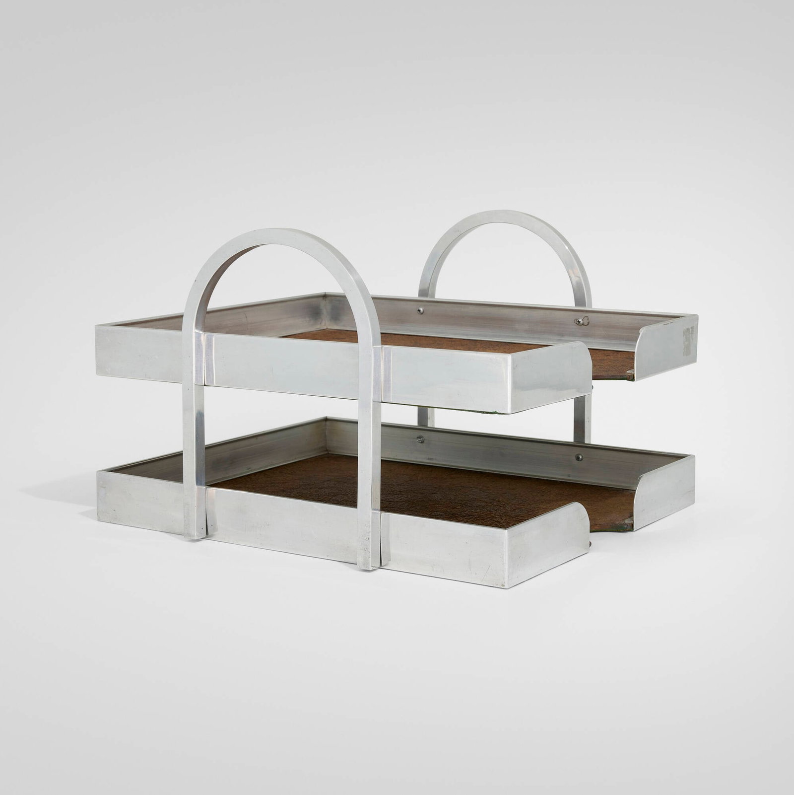 Bushman-Moore Inc., Tiered paper tray: Bushman-Moore Inc. Tiered paper tray USA, mid-20th century Aluminum, leather 7.625 h x 10.375 w x 11.875 d in (19 x 26 x 30 cm) Impressed manufacturer's mark to side 'The BM Line