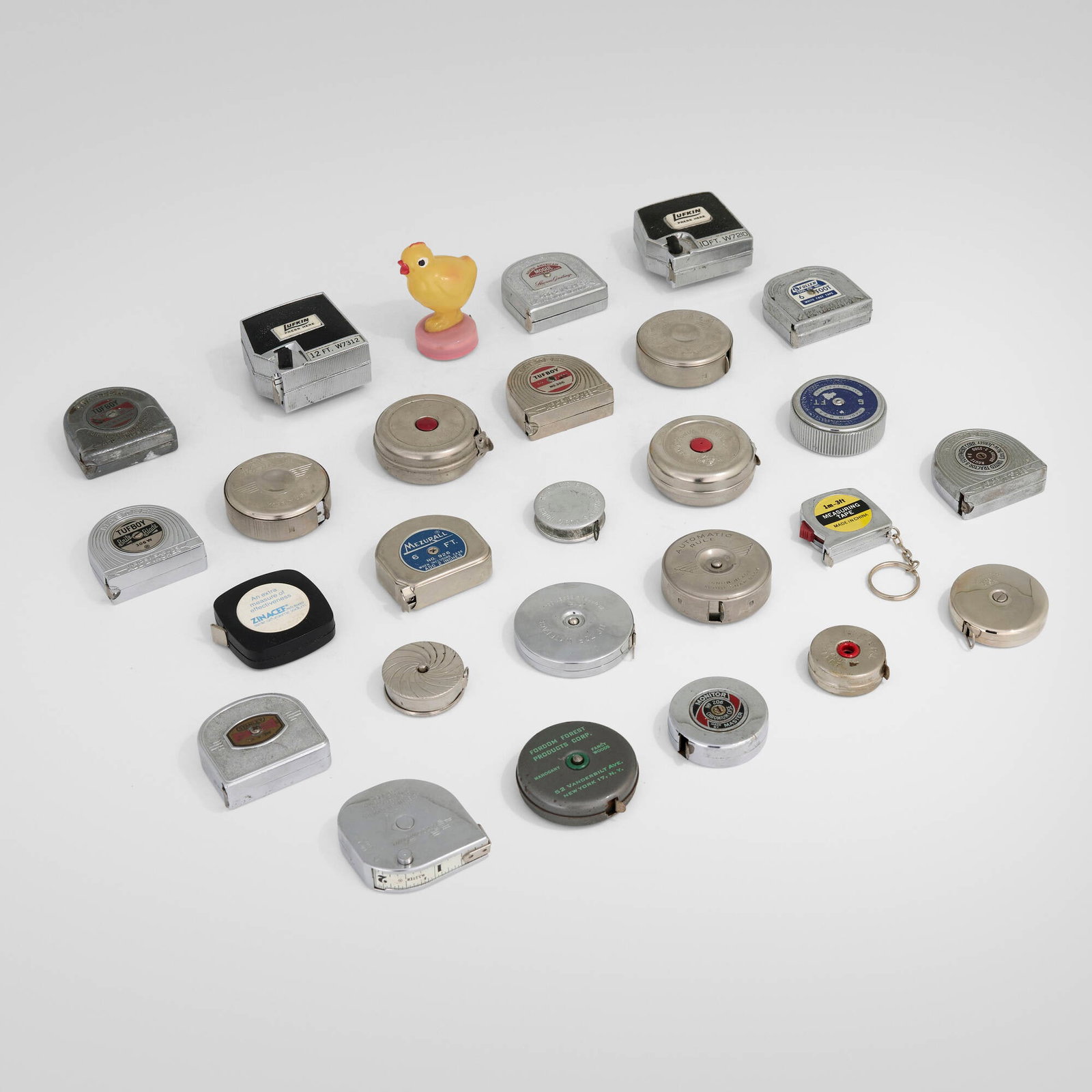 20th Century, Collection of twenty-seven tape measures: 20th Century Collection of twenty-seven tape measures chrome-plated steel, plastic, crackle-lacquered steel largest: 2.375 h x 1.5 w x 2.25 d in (6 x 4 x 6 cm) smallest: 0.375 h x 1.375 dia in (1 x 3
