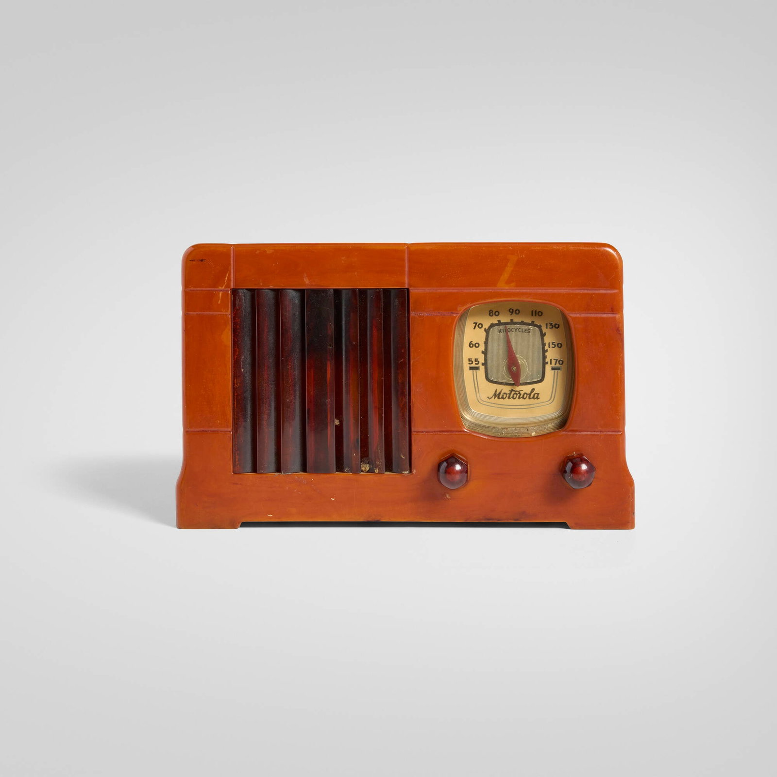 Motorola, Inc., Vertical Grille radio, model 52: Motorola, Inc. Vertical Grille radio, model 52 USA, 1939 Catalin, plastic 5.75 h x 9.25 w x 6 d in (15 x 23 x 15 cm) Embossed manufacturer's mark to dial 'Motorola'. Paper