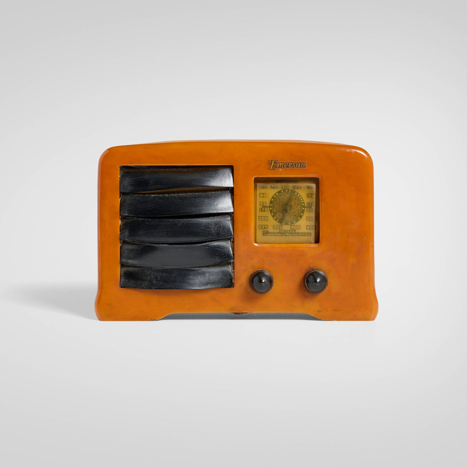 Emerson Radio & Phonograph Corp., Little Miracle radio, model AX235: Emerson Radio & Phonograph Corp. Little Miracle radio, model AX235 USA, 1938 Catalin, plastic 5.75 h x 8.875 w x 4.25 d in (15 x 23 x 11 cm) Printed manufacturer's mark to dial 'Emerson
