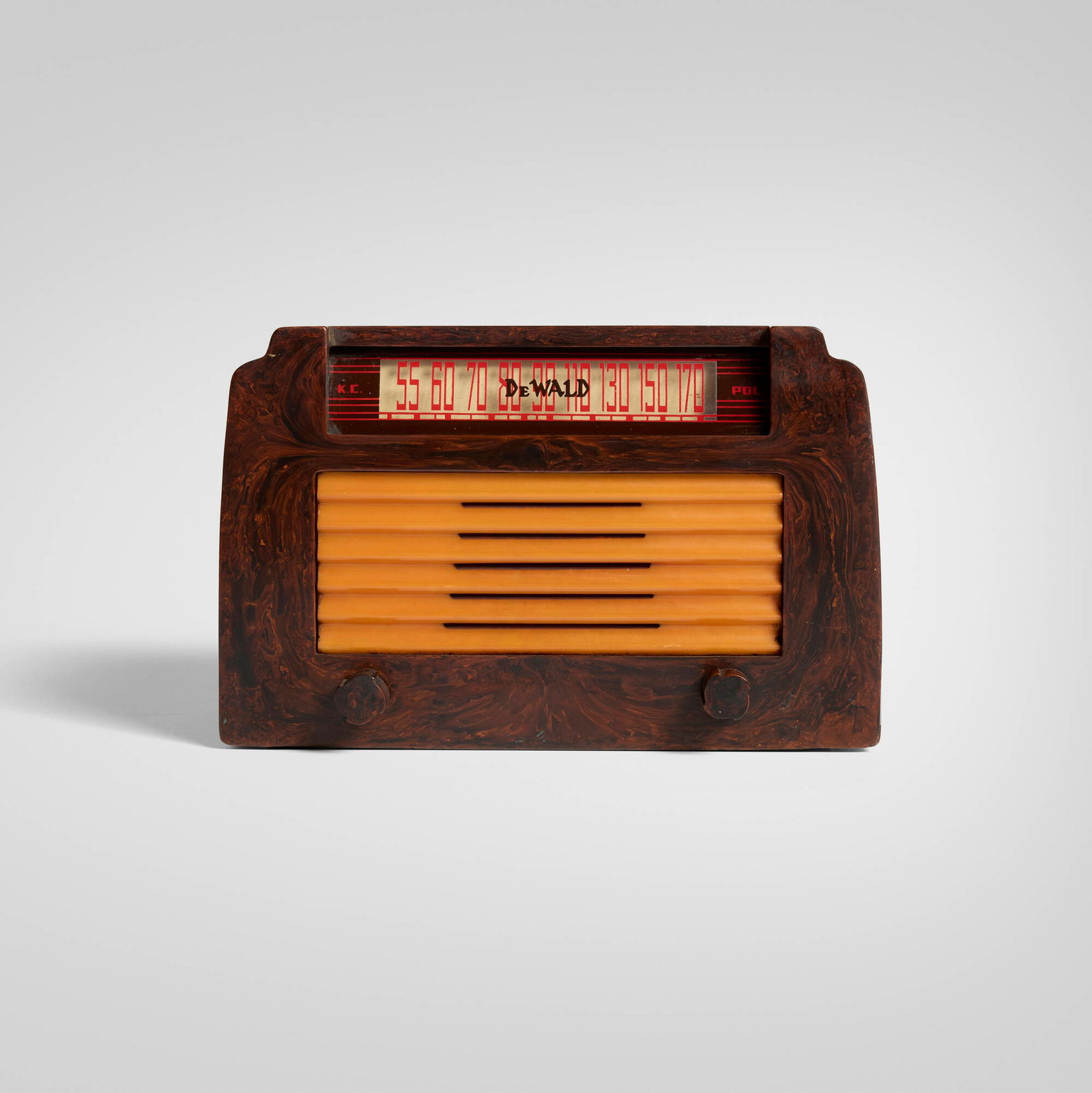 DeWald Radio Manufacturing Corporation, Step-Top radio, model A-502: DeWald Radio Manufacturing Corporation Step-Top radio, model A-502 USA, 1946 Catalin, plastic 6.25 h x 9.75 w x 6.375 d in (16 x 25 x 16 cm) Screen-printed manufacturer's mark to display