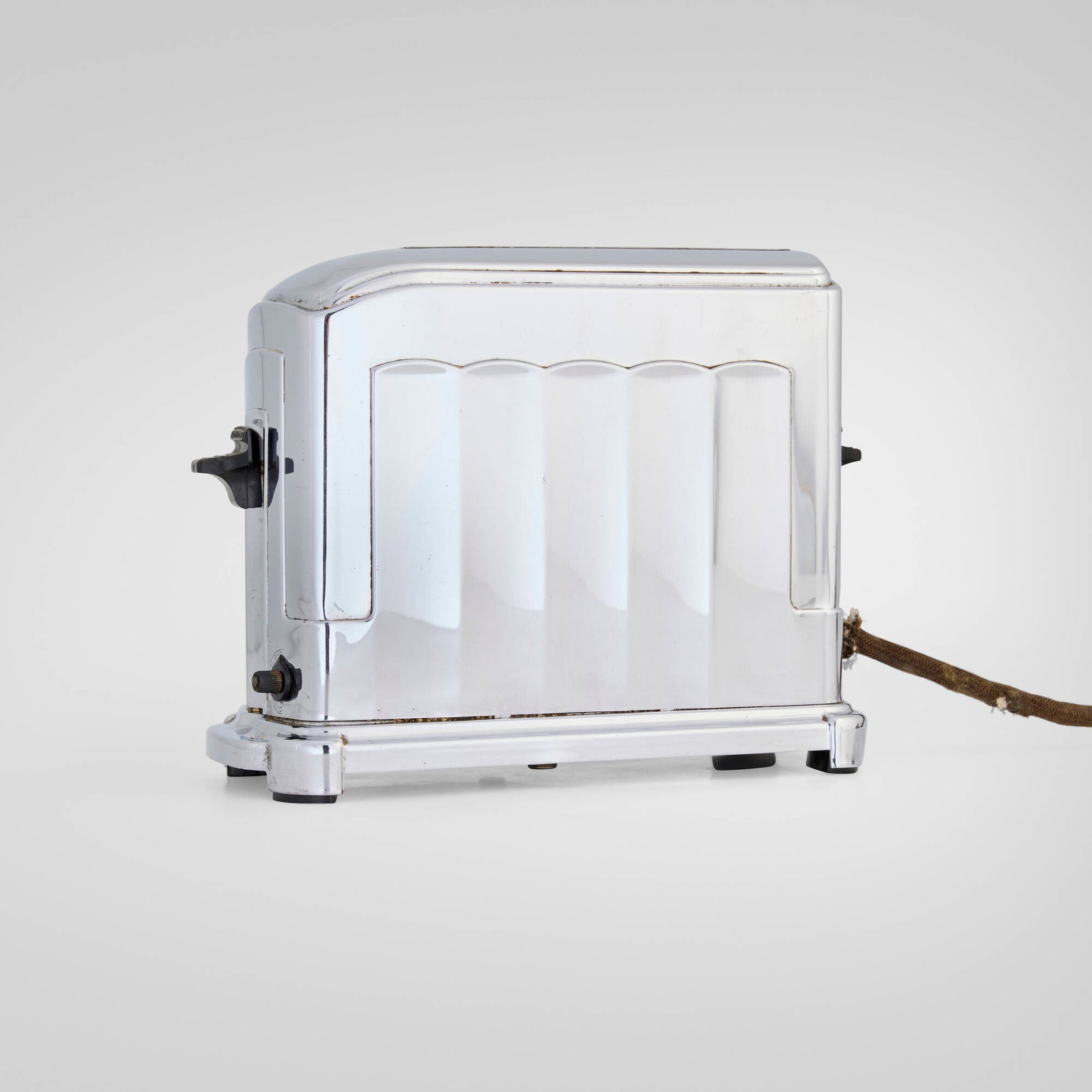 McGraw Electric Company, Toastmaster single-slice toaster, model 1A4: McGraw Electric Company Toastmaster single-slice toaster, model 1A4 USA, 1934-39 chrome-plated steel, Bakelite 7 h x 9.25 w x 4.125 d in (18 x 23 x 10 cm) An example of this design is held in the