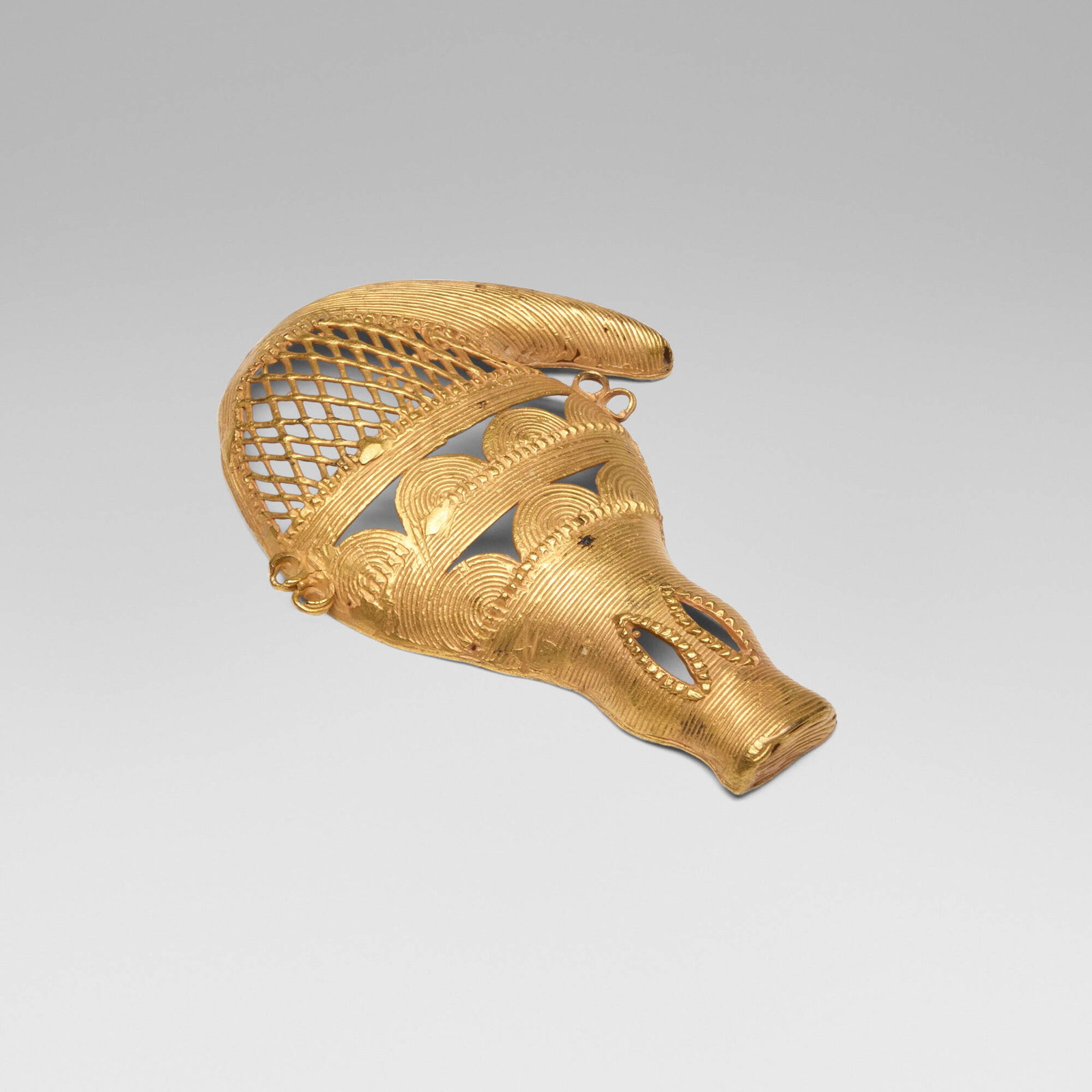 Kyaman (Akan), Gold crocodile pendant: Kyaman (Akan) Gold crocodile pendant Cote d'Ivoire, 20th century gold 4 h x 2.75 w x 0.5 d in (10 x 7 x 1 cm) Gold ornaments such as this were produced by Akan goldsmiths using the sophisticated
