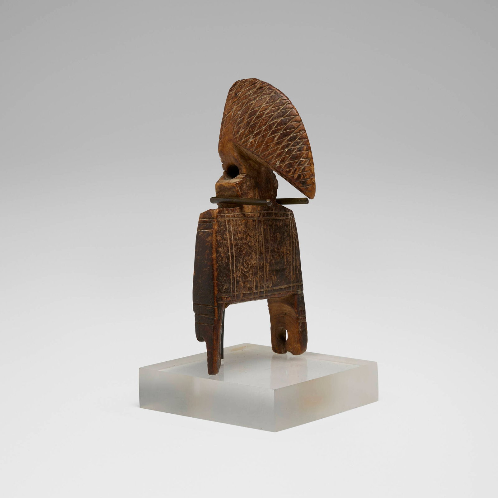 Senufo, Heddle pulley: Senufo Heddle pulley Cote d'Ivoire, 20th century carved wood 5.5 h x 2.75 w x 2 d in (14 x 7 x 5 cm) Provenance: Private Collection, Maryland This work will ship from Chicago, Illinois.