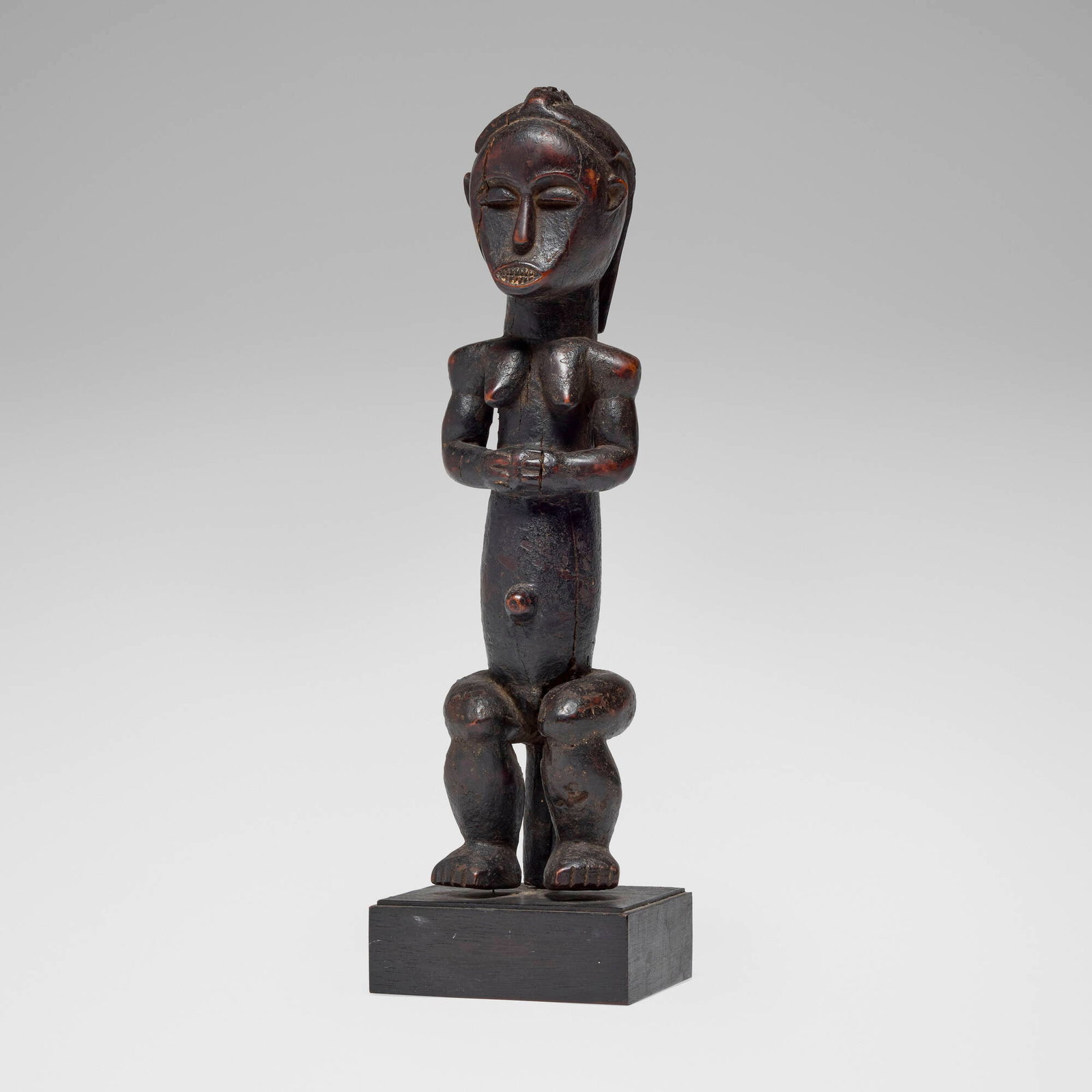 Fang, Ntumu reliquary guardian figure: Fang Ntumu reliquary guardian figure Gabon, 20th century carved wood 15.5 h x 3.75 w x 3.5 d in (39 x 10 x 9 cm) This work will ship from Los Angeles, California.
