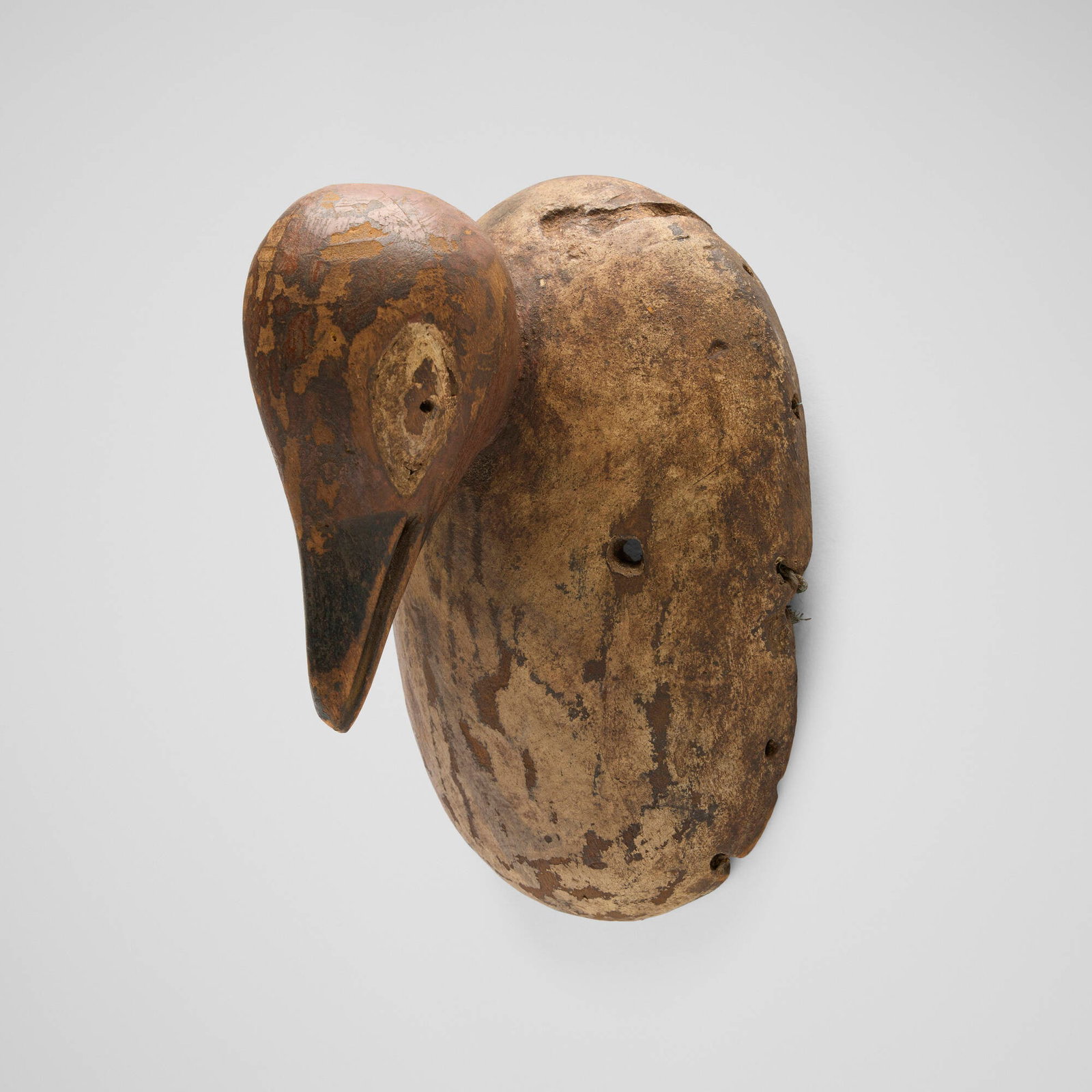 Makua, Avian mask: Makua Avian mask Tanzania, 20th century carved wood 9 h x 6 w x 5.25 d in (23 x 15 x 13 cm) This work will ship from Chicago, Illinois.