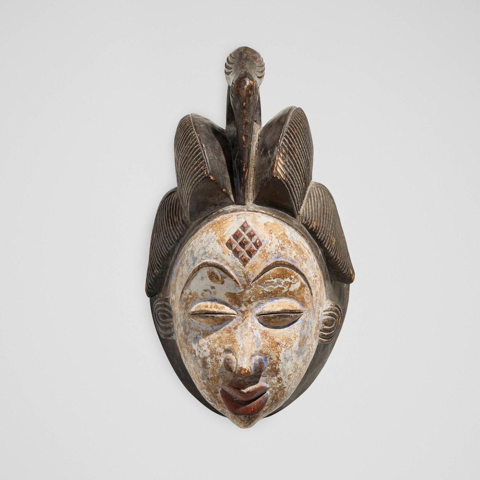Punu, Mask: Punu Mask Gabon, 20th century carved wood, pigment 14.5 h x 8 w x 7 d in (37 x 20 x 18 cm) Provenance: Private Collection, California This work will ship fr