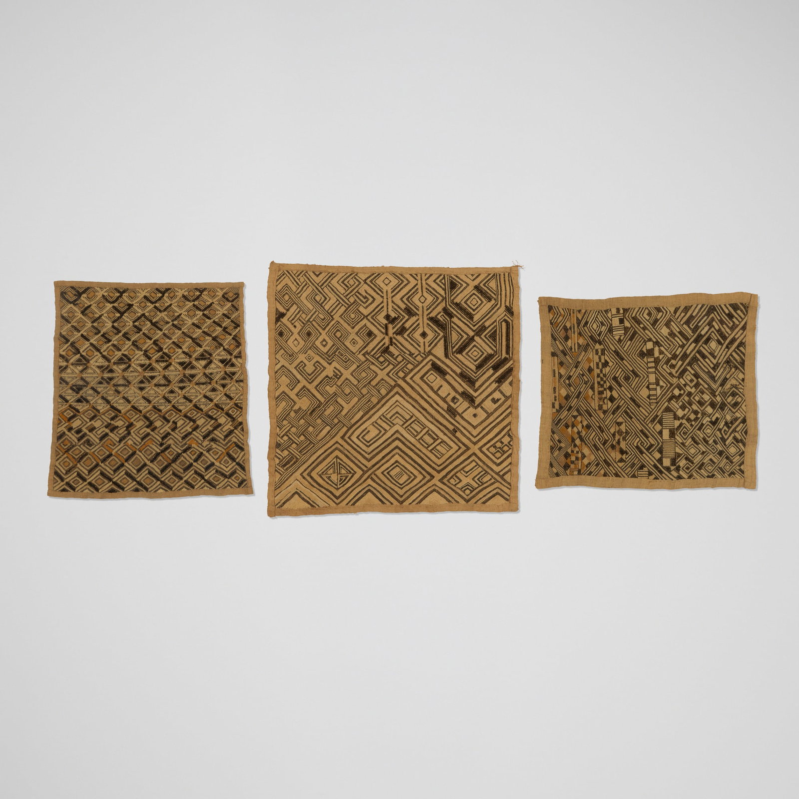 Kuba, Shoowa prestige panels, set of three: Kuba Shoowa prestige panels, set of three Democratic Republic of the Congo, 20th century raffia cloth 21 h x 21 w in (53 x 53 cm) 18.5 h x 17.25 w in (47 x 44 cm) 16 h x 18.5 w in (41 x 47 cm) This