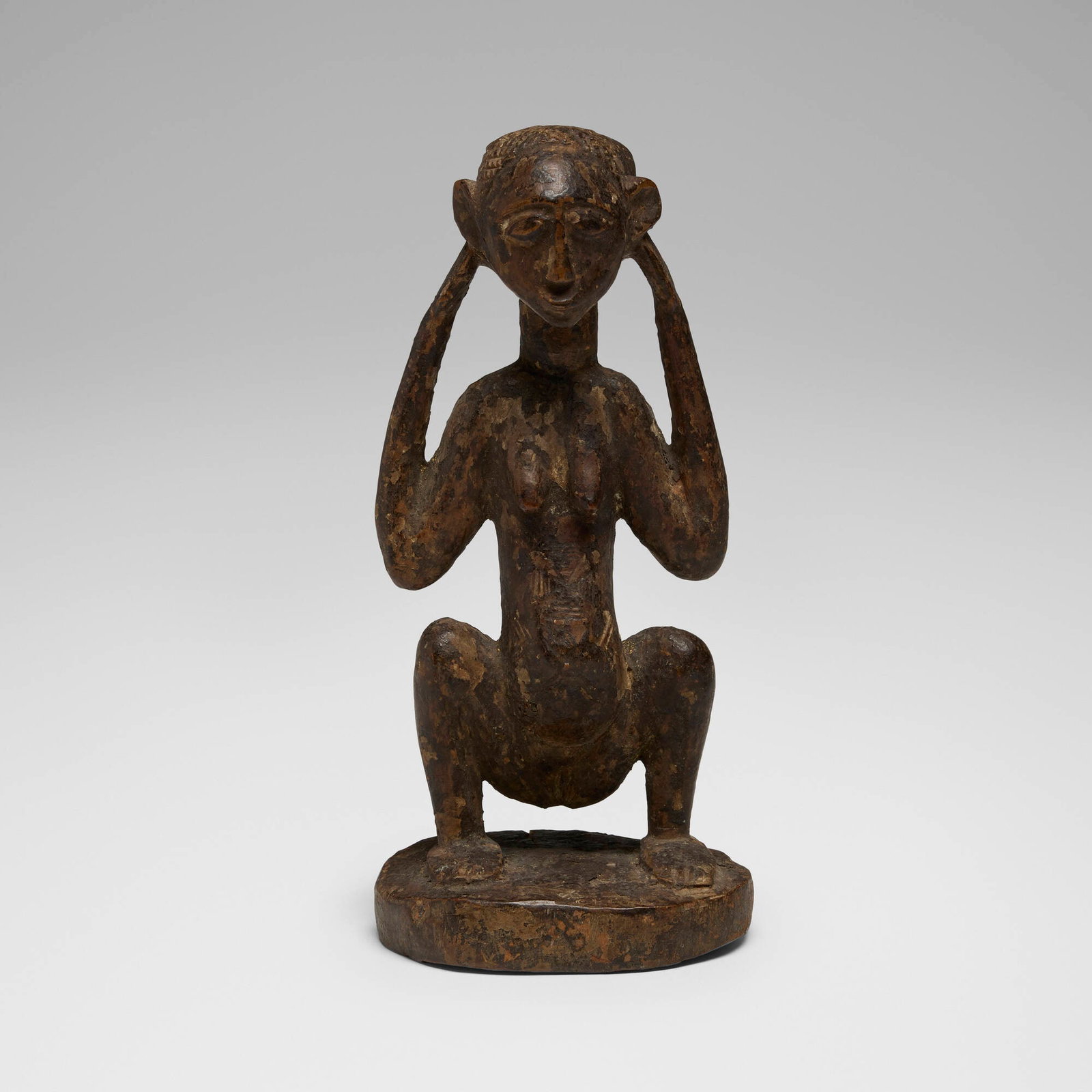 Luba or Lulua (Luluwa), Crouching figure: Luba or Lulua (Luluwa) Crouching figure Democratic Republic of the Congo, 20th century carved wood 9.5 h x 4 w x 4 d in (24 x 10 x 10 cm) This work will ship from Chicago, Illinois.