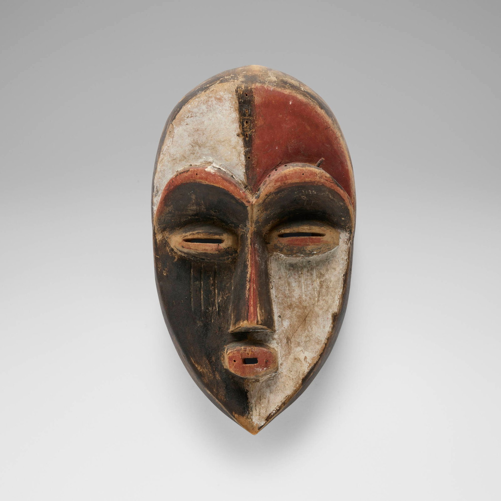 Aduma, Mask: Aduma Mask Gabon, late 19th/early 20th century carved and painted wood 15 h x 8.5 w x 4.75 d in (38 x 22 x 12 cm) Provenance: Pace Primitive, New York | Acquired from the previ