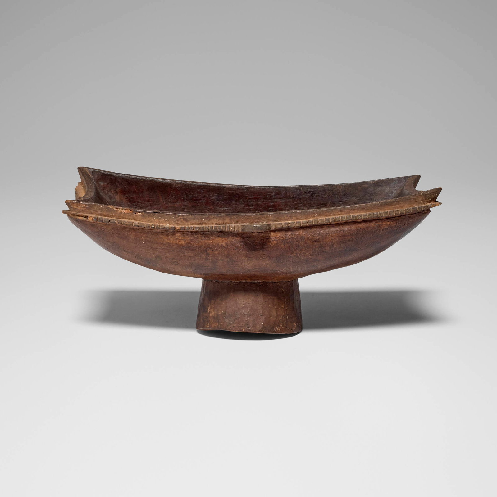Papuan, Pedestal bowl: Papuan Pedestal bowl New Guinea, 20th century carved wood 7.5 h x 17 w x 9.75 d in (19 x 43 x 25 cm) Provenance: Michael Sorafine, Los Angeles | Private Collection This work will ship from Los