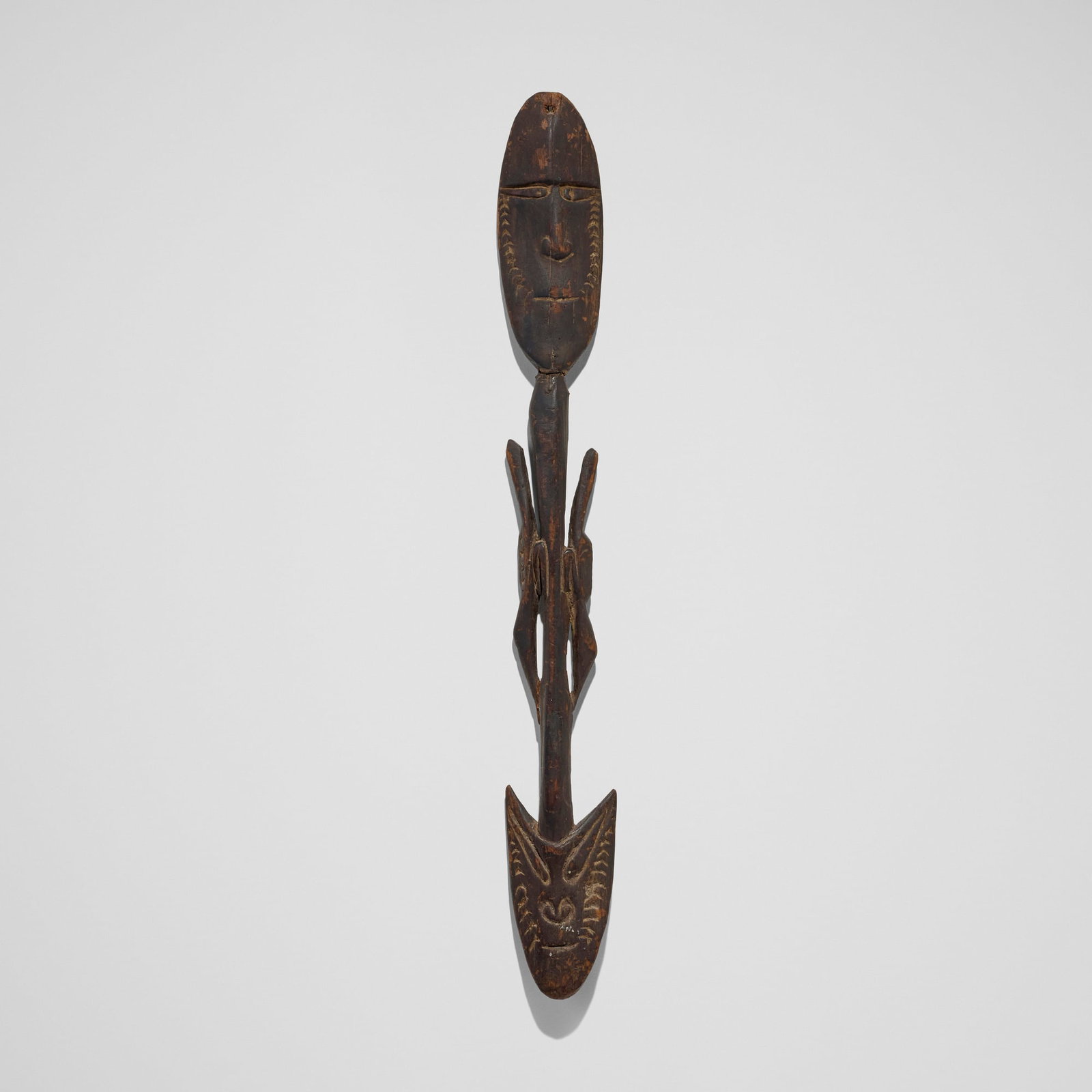 Sepik River, Suspension hook figure: Sepik River Suspension hook figure Papua New Guinea, 20th century carved wood 36 h x 4.75 w x 1.5 d in (91 x 12 x 4 cm) Provenance: Private Collection, San Marino, CA This work will ship from Los