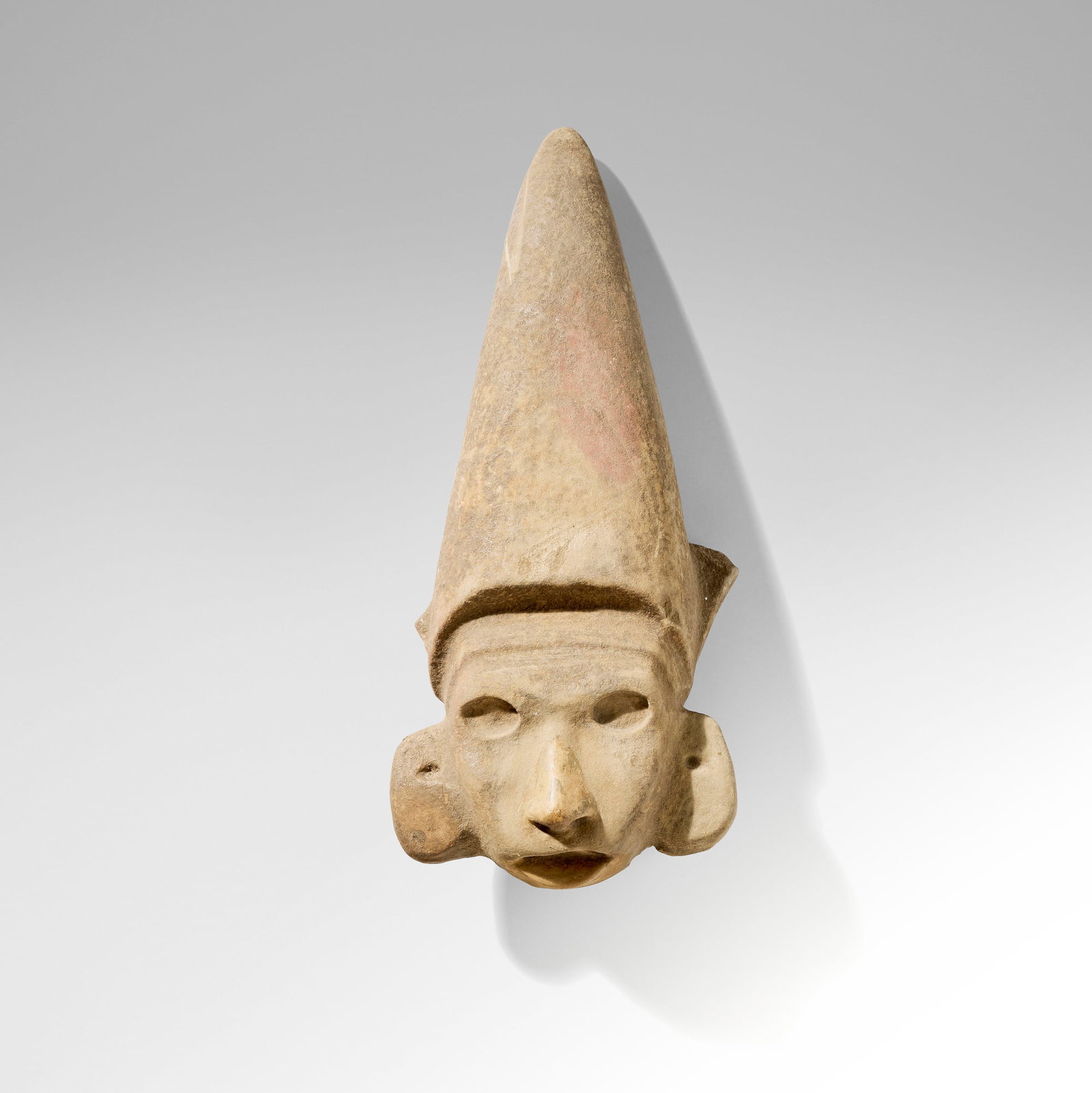 Huastec, Centeocihu?tl Goddess of Maize head fragment: Huastec Centeocihu?tl Goddess of Maize head fragment Tamaulipas, Mexico, c. 900 - 1200 CE carved stone 17 h x 7.5 w x 4.5 d in (43 x 19 x 11 cm) Provenance: Private Collection, San Marino, CA This