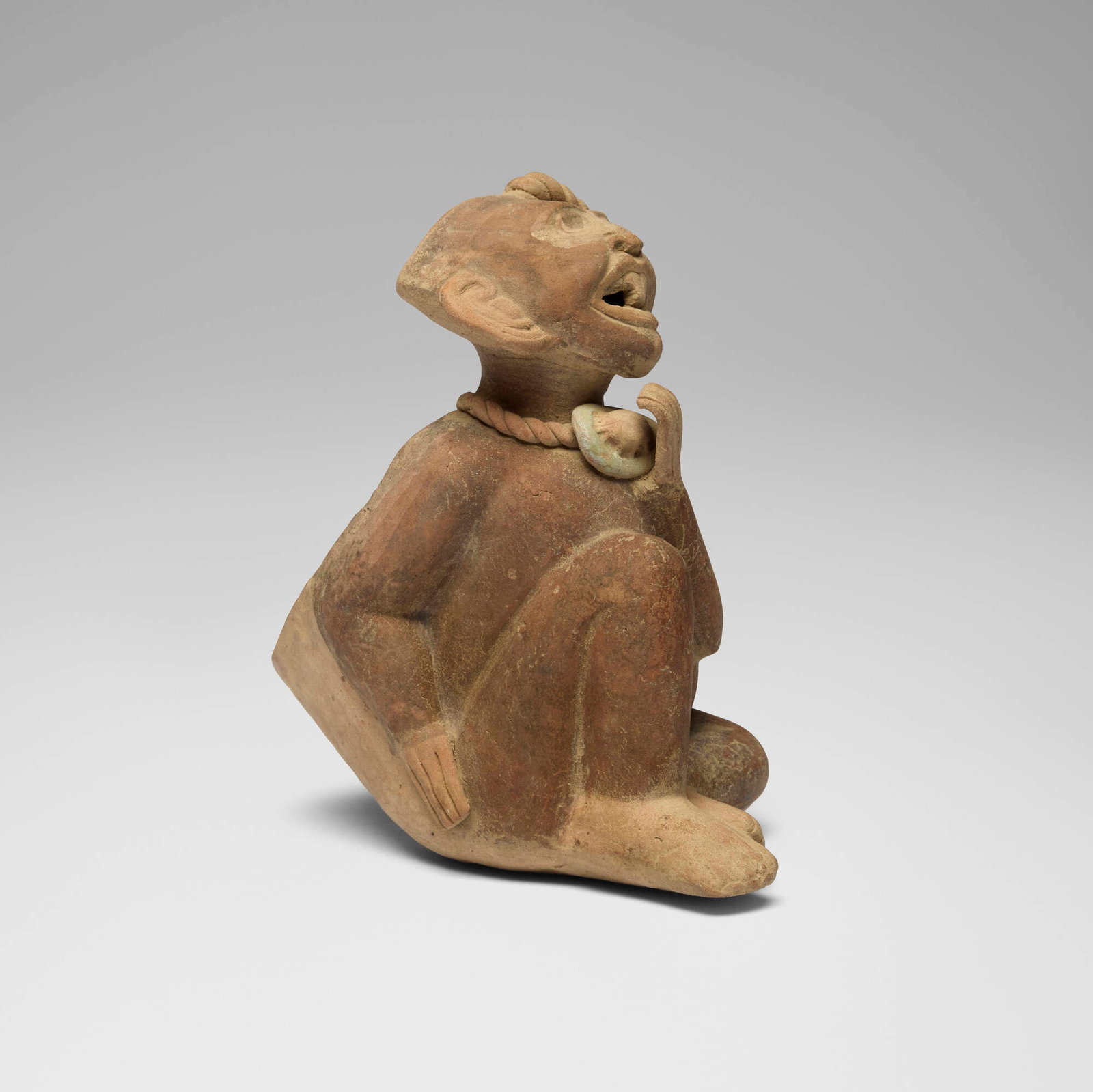 Veracruz, Sonriente figural vessel: Veracruz Sonriente figural vessel Mexico, 600-1000 CE earthenware 7.5 h x 4.125 w x 6.75 d in (19 x 10 x 17 cm) Sold with a digital copy of the original invoice from Throckmorton Fine Art. <