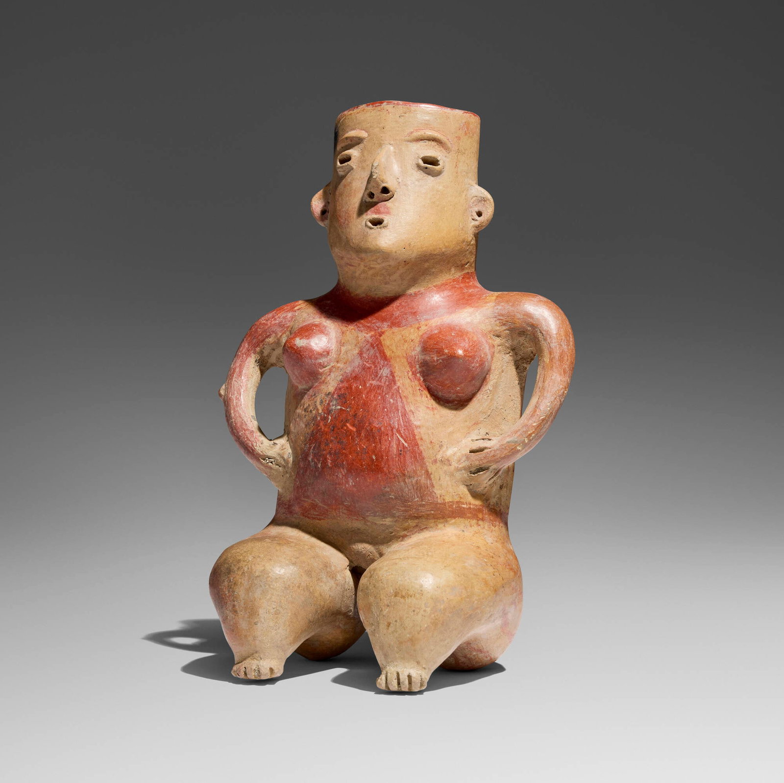 Zacatecas, Seated female figure: Zacatecas Seated female figure Western Mexico, Protoclassic, c. 100 BCE-250 CE earthenware with ochre pigment 12 h x 8 w x 7 d in (30 x 20 x 18 cm) Provenance: Private Collection, California This