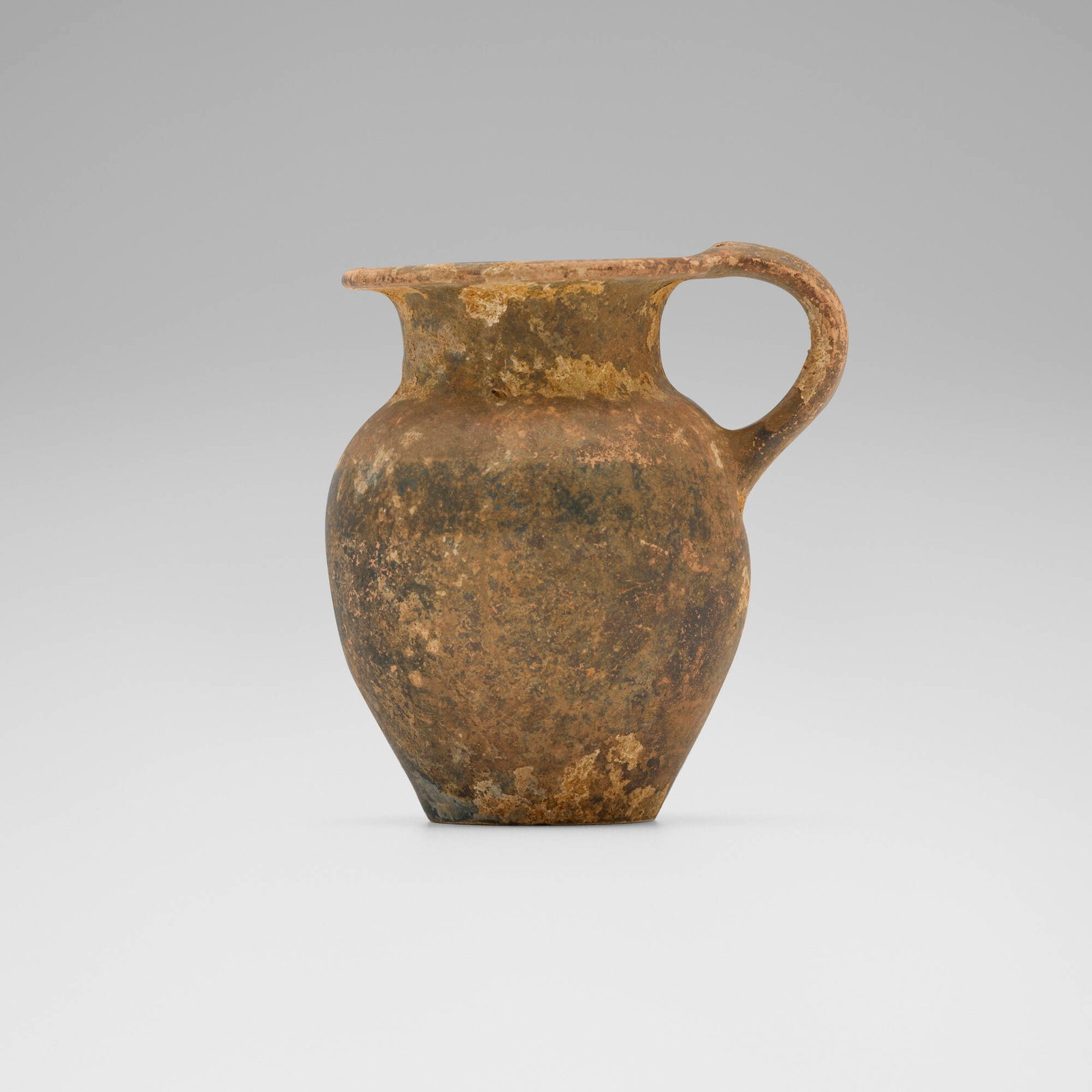 Etruscan, Olpe (jar): Etruscan Olpe (jar) c. 6th-4th century BCE glazed earthenware 2.75 h x 2.5 w x 2 d in (7 x 6 x 5 cm) This work will ship from Chicago, Illinois.