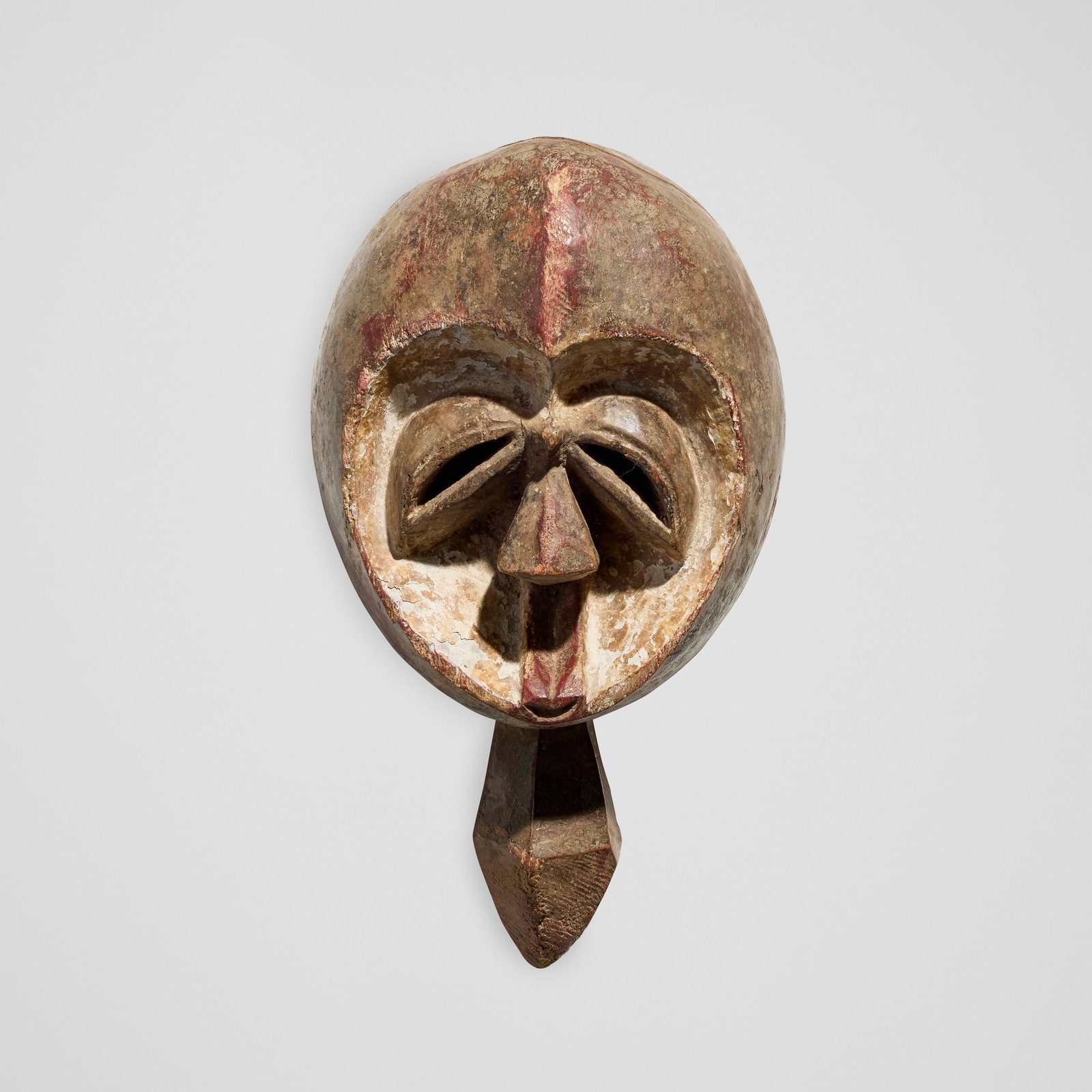 Kwele (Bakwele), Mask: Kwele (Bakwele) Mask Gabon, 20th century carved wood, pigment 4.75 h x 6.75 w x 4.75 d in (12 x 17 x 12 cm) Provenance: Private Collection, California This work will ship from Los Angeles, California.