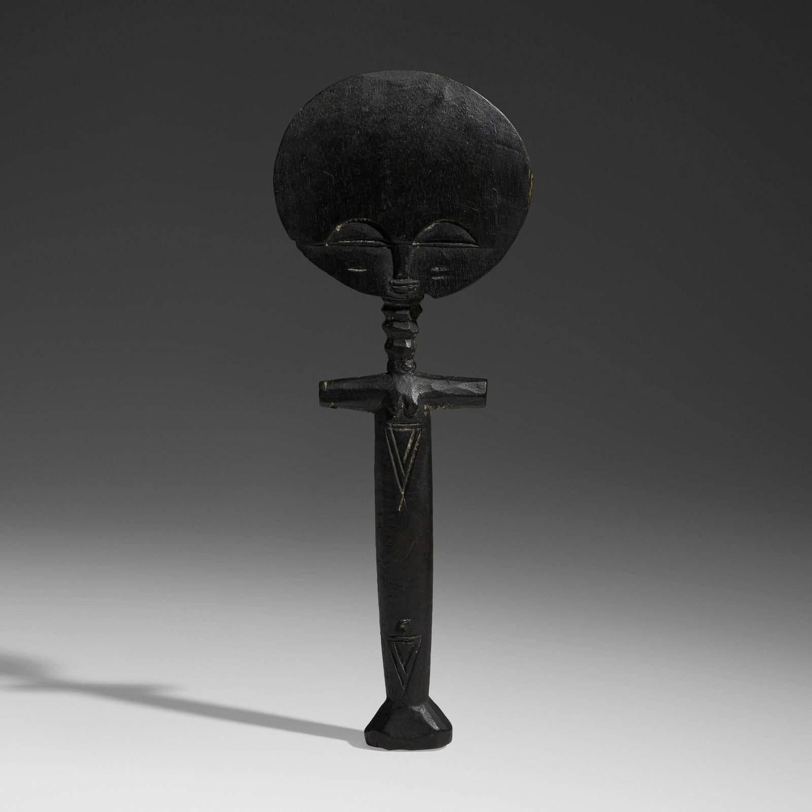 Asante (Ashanti), Akua'ba fertility figure: Asante (Ashanti) Akua'ba fertility figure Ghana, 20th century carved wood 12.5 h x 4.5 w x 1 d in (32 x 11 x 3 cm) Provenance: Private Collection, Maryland This work will ship from Chicago, Illinois.