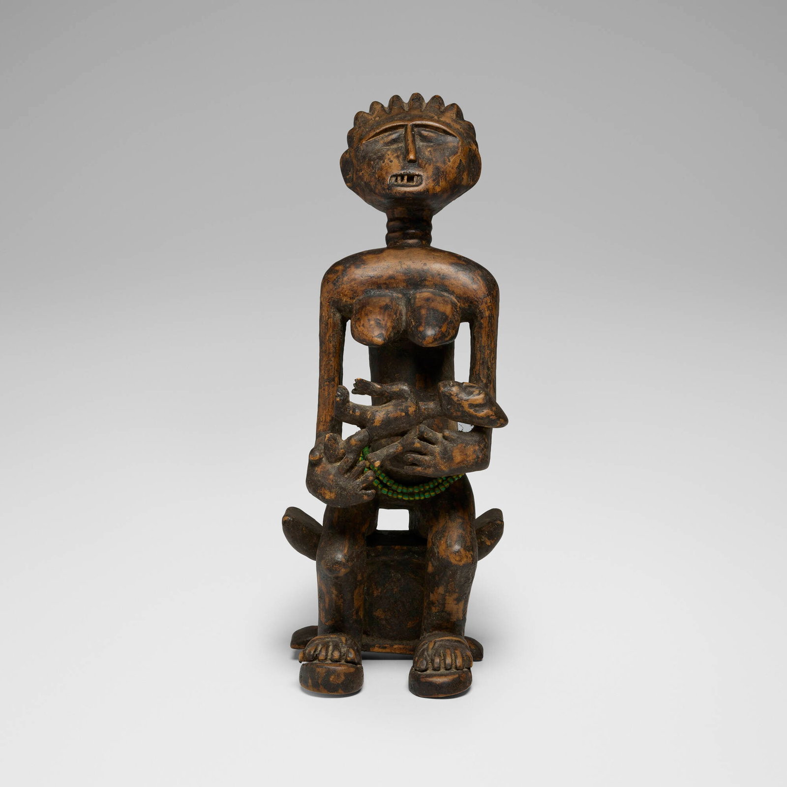 Asante (Ashanti), Maternity figure: Asante (Ashanti) Maternity figure Ghana, 20th century carved wood, beads 18.5 h x 7 w x 6 d in (47 x 18 x 15 cm) Provenance: Private Collection, Maryland This work will ship from Chicago, Illinois.