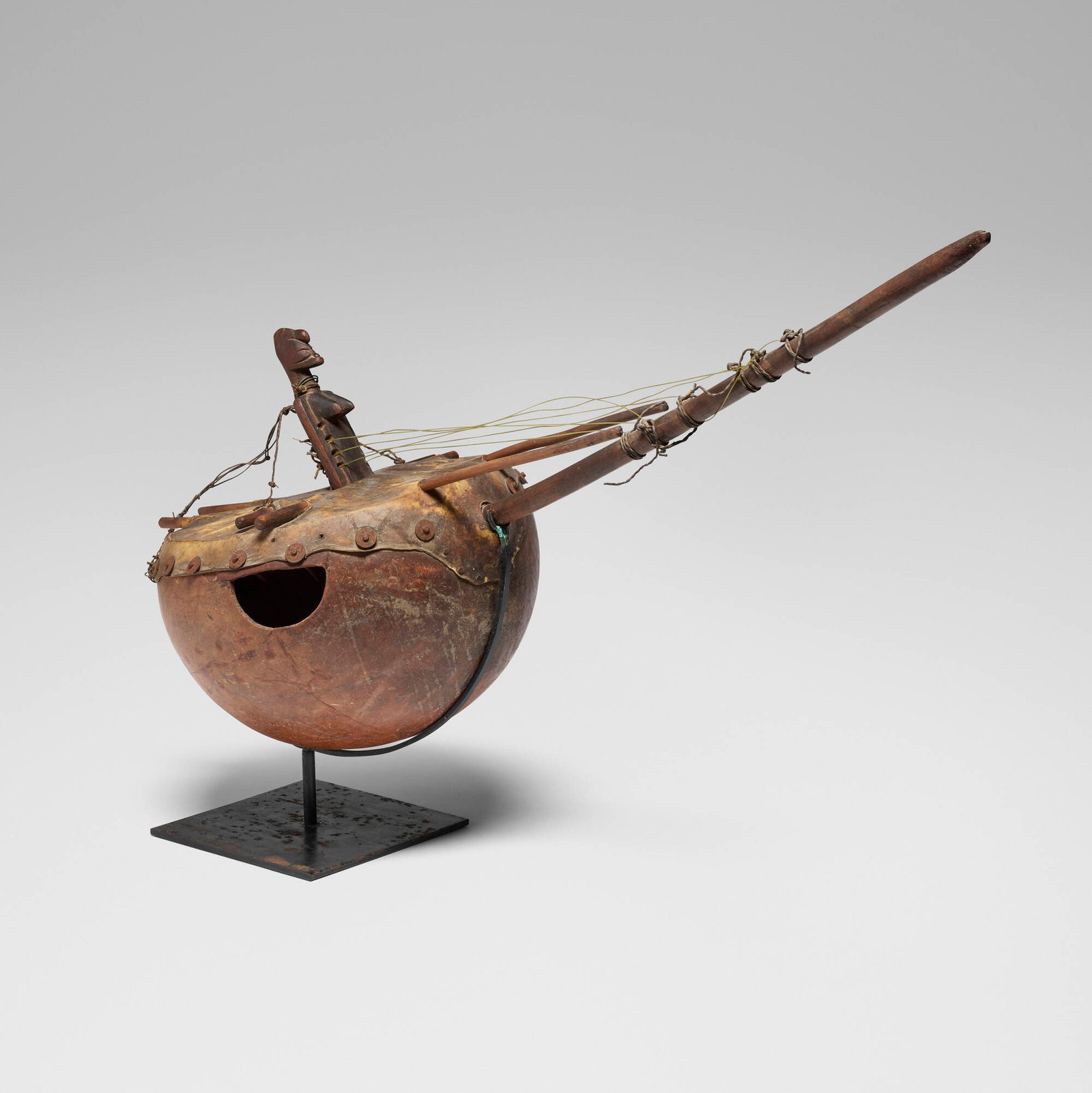 Senufo, Harp: Senufo Harp Cote d'Ivoire, 20th century gourd, animal hide, metal, carved wood, wire, nylon 17 h x 44 w x 14.5 d in (43 x 112 x 37 cm) Provenance: Michael Sorafine, Los Angeles | Private Collection
