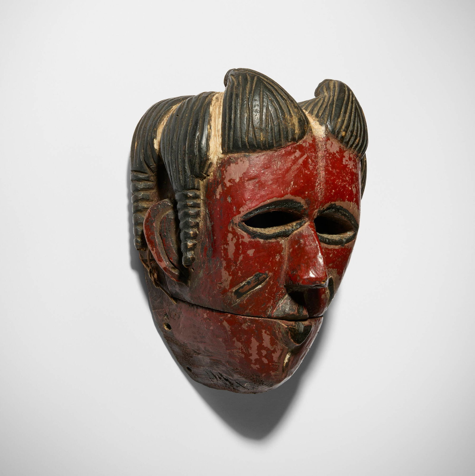 Ogoni, Mask with articulated jaw: Ogoni Mask with articulated jaw Nigeria, 20th century carved and painted wood, string 7 h x 6 w x 4 d in (18 x 15 x 10 cm) Provenance: Jeffrey Hammer and Deborah Stokes, Chicag