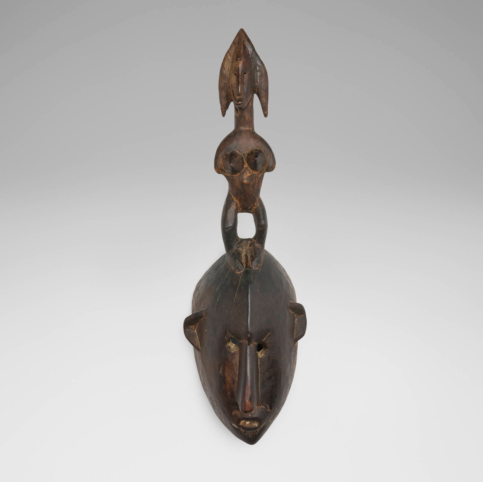 Bamana, Helmet mask: Bamana Helmet mask Mali, 20th century carved wood 28 h x 9 w x 7.5 d in (71 x 23 x 19 cm) Provenance: Private Collection, Maryland This work will ship from