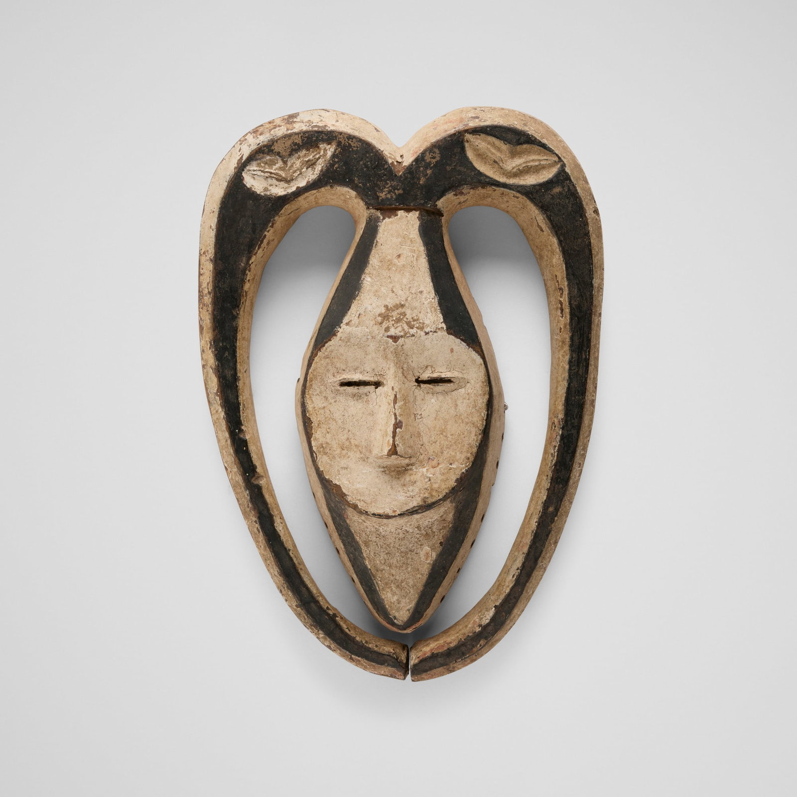 Kwele (Bakwele), Bata (ram) mask: Kwele (Bakwele) Bata (ram) mask Gabon, mid-to-late 20th century carved and painted wood 12 h x 8 w x 2.5 d in (30 x 20 x 6 cm) Most Bata masks in museum collections were acquired durin