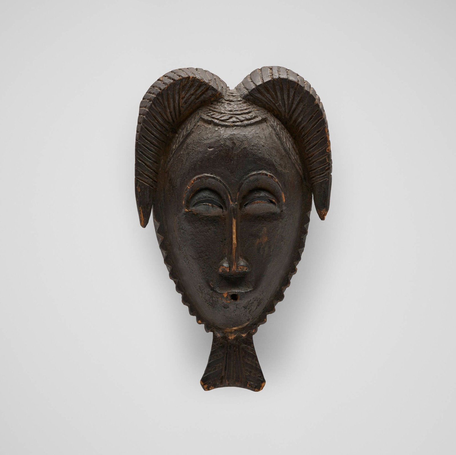 Yaure, Mask: Yaure Mask Cote d'Ivoire, late 19th/early 20th century carved wood 12 h x 8 w x 3 d in (30 x 20 x 8 cm) Provenance: Pace Primitive, New York | Acquired from the previous in 1996 by the present owner