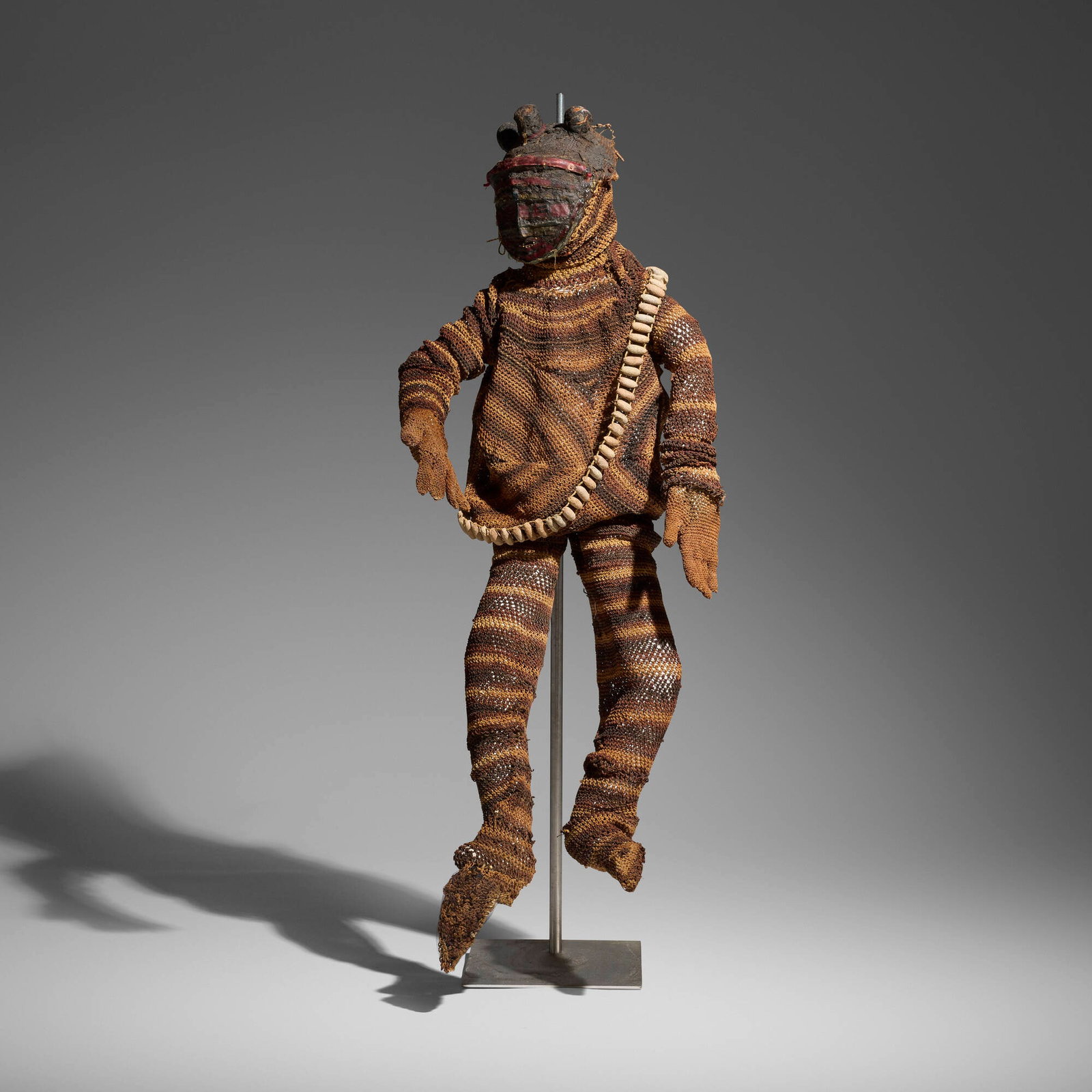 Chokwe, Likishi dance costume: Chokwe Likishi dance costume Angola, 20th century woven fibers with encrustation, seed pods 59 h x 22.5 w x 24 d in (150 x 57 x 61 cm) Provenance: Private Collection, Maryland This work will ship