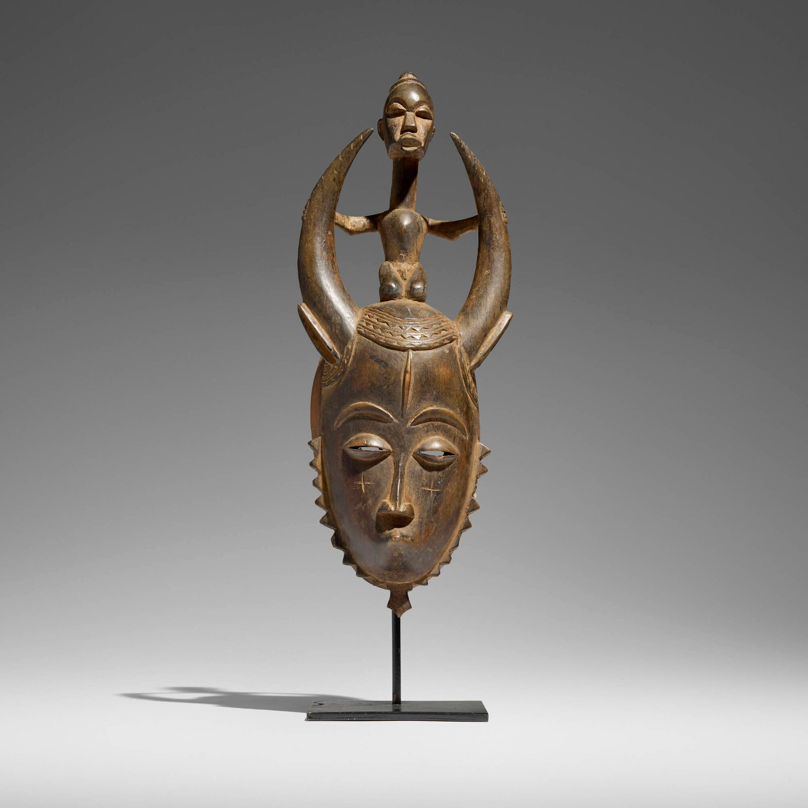 Baule, Mask: Baule Mask Cote d'Ivoire, late 20th century carved wood 16.5 h x 7 w x 4 d in (42 x 18 x 10 cm) Provenance: The Sam and Beverly Maloof Collection This work will ship from Los Angeles, California.