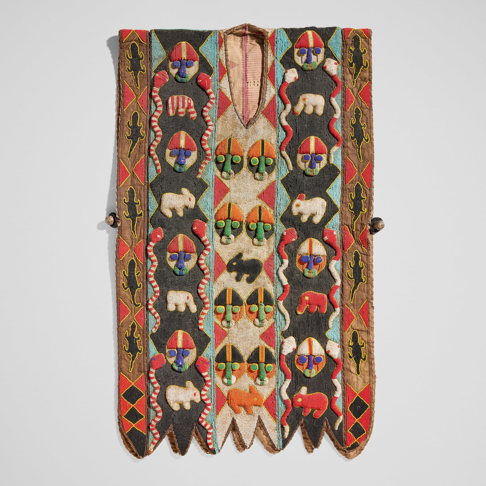 Yoruba, Sango tunic: Yoruba Sango tunic 20th century glass beads, textile, leather 42.5 h x 26 w x 1.5 d in (108 x 66 x 4 cm) Provenance: The Sam and Beverly Maloof Collection This work will ship from Los Angeles,