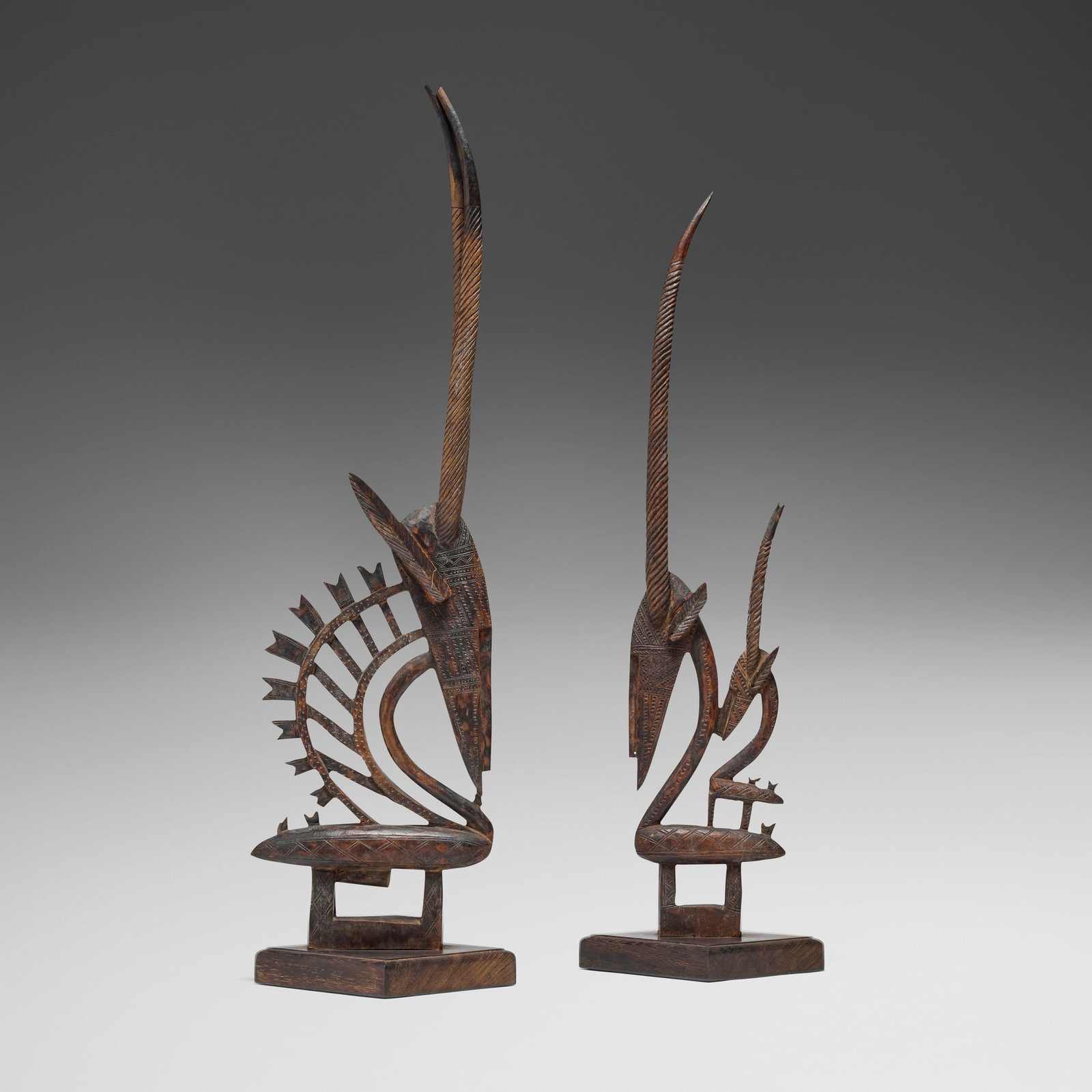 Bamana, Chi Wara (antelope headdresses), pair: Bamana Chi Wara (antelope headdresses), pair Mali, 20th century carved wood 41 h x 3 w x 11.5 d in (104 x 8 x 29 cm) 37.25 h x 2.5 w x 7.5 d in (95 x 6 x 19 cm) Provenance: The Sam and Beverly Maloof
