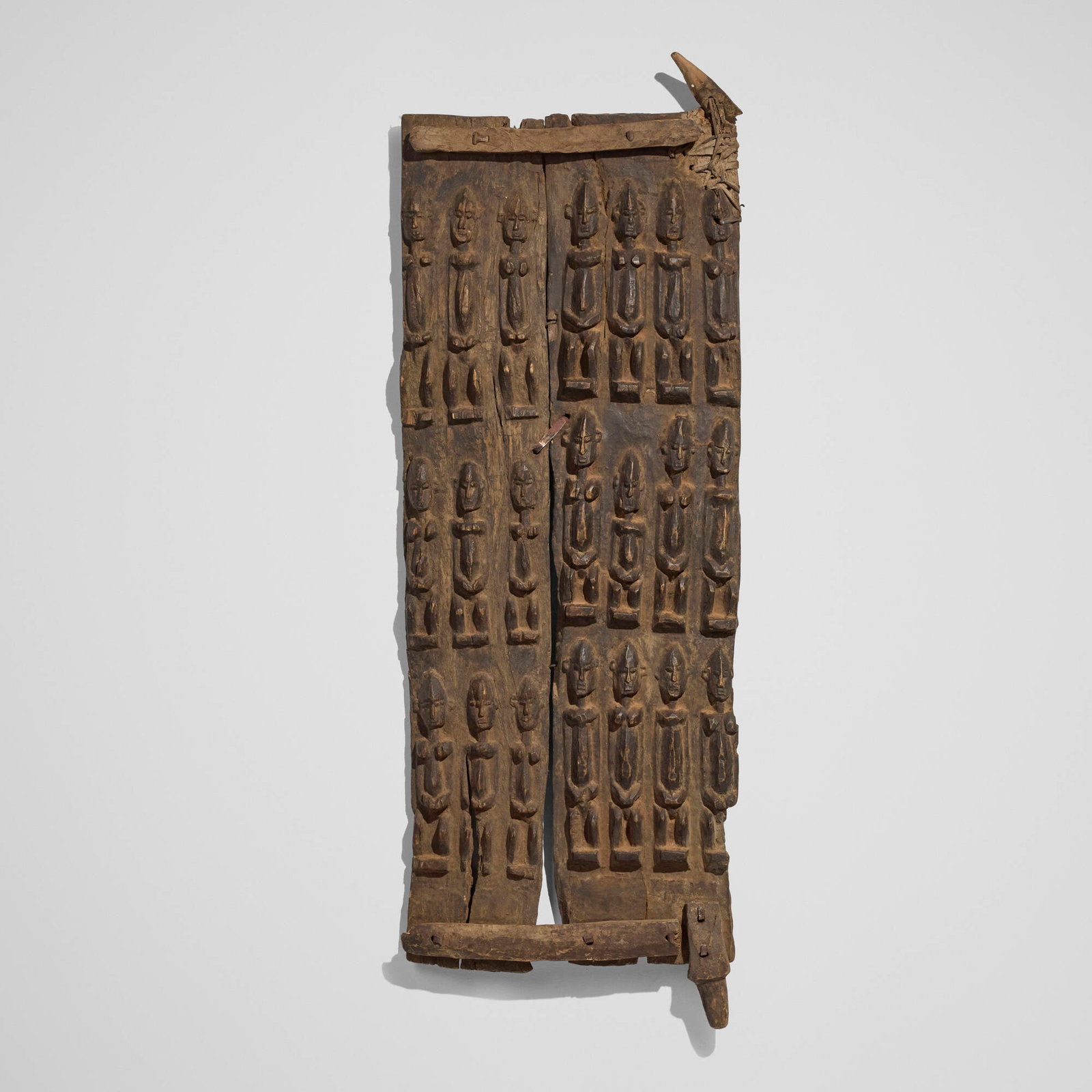 Dogon, Granary door: Dogon Granary door Mali, 20th century carved wood, steel 60 h x 20 w x 2 d in (152 x 51 x 5 cm) Provenance: The Sam and Beverly Maloof Collection This work will ship from Los Angeles, California.